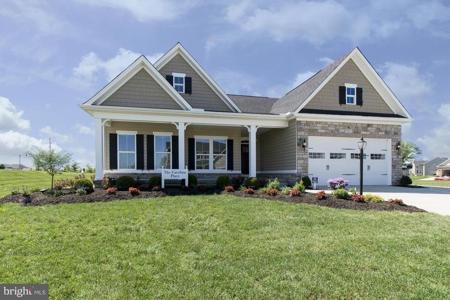 Carolina Place featuring one floor living To Be Built at Two Rivers - a 55+ Active Adult community that will delight you from the moment you move into your brand new, single-family home. Surrounded by forest conservation, Two Rivers sits on 1,468 acres of natural beauty. With a 15,000 square foot clubhouse, you can enjoy indoor and outdoor pools and much more. Images shown are representative only.