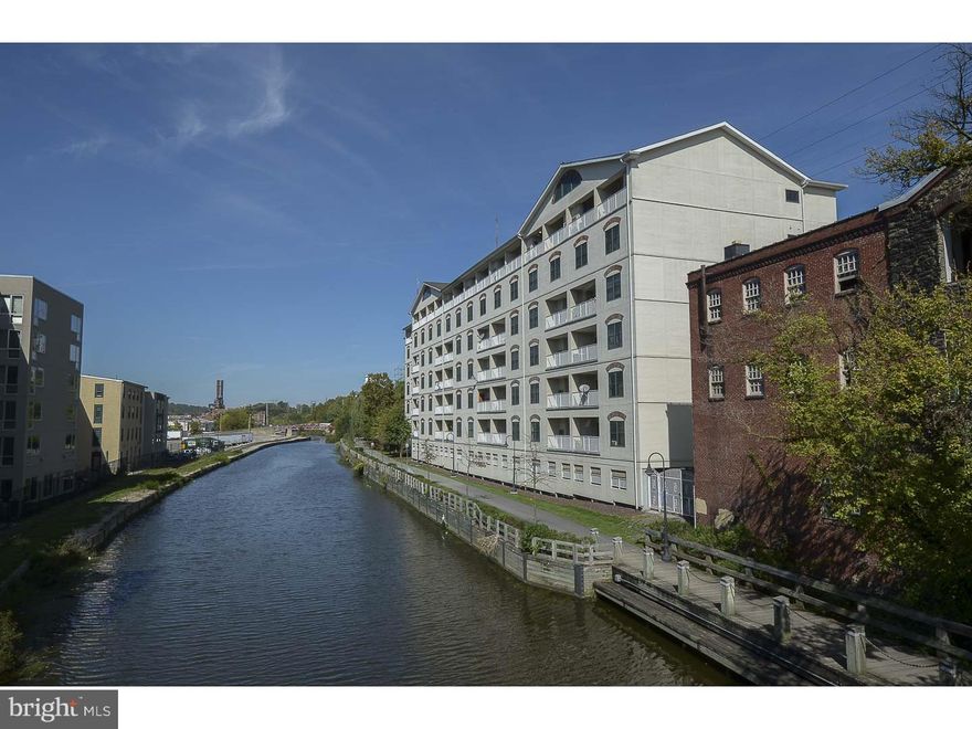 You will not find anything else like this currently on the market!  Luxurious penthouse living with scenic views, close to all the excitement and entertainment the city has to offer! Located in the sought-after "Water Mill at Manayunk" overlooking the water, the comforts and living spaces are unmatched.  The main floor boasts high ceilings, open floor plan, plenty of natural light, half bathroom, and a balcony with incredible views. Lower level offers a master suite with private bath and large walk-in closet, a generously sized second bedroom, and second full bath. Secure access building and includes use of a covered parking spot right next to the elevator.