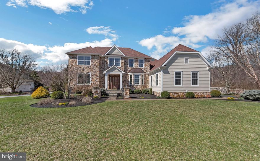 ALL OFFERS DUE 10AM, SUNDAY APRIL 6th.  
Perched on a lush, expansive lot in desirable Saddlebrook Farms, less than one
mile from Willistown Preserve, this stone-front, updated colonial with dreamy
backyard and renovated kitchen makes a lasting impression. From the newer
flagstone front porch, enter the main level and marvel at the many thoughtful
details, from refinished hardwood floors and recessed lighting to custom
woodwork, neutral paint and abundant natural light. The two-story foyer is flanked
by a formal living room on side and a light-filled dining room with beautiful bay
window, chair rail and crown molding directly opposite. From the dining room, a
short hallway leads to the fully renovated, eat-in kitchen with island seating, closet
pantry, tasteful white cabinetry, backsplash and high-end
appliances—including microwave drawer, double  oven and SubZero® refrigerator. The kitchen
connects a sunny breakfast room with French doors that open to a spacious,
refinished three-season room. A windowed family room with gas fireplace lies just
beyond. A home office, powder room and mudroom with ample storage and direct
access to the three-car garage complete this seamless first floor. From the second-
floor landing, double doors conceal a spacious primary suite with walk-in custom
closet and renovated ensuite bath with walk in shower, soaking tub and plentiful
natural light. Down the hall you’ll find three secondary bedrooms and a full
hallway bath. Back downstairs, the finished basement offers an open area for
relaxation and play, plus a powder room, home gym and cozy bonus room that
leads to a temperature-controlled wine cellar. Savor endless summer days (and
nights) in the heated pool with surrounding patio out back, along with over an acre
of flat, professionally landscaped greenspace. The list of improvements and upgrades by the current owners goes on, several include, newer hardiboard siding, real stone front, generator, fencing, resealed driveway, enhanced landscaping and much more! Zoned for highly rated West Chester
Area School District, this home sits mere minutes from East Goshen Park, walking
trails, playgrounds, sports fields, downtown Malvern and local transit.