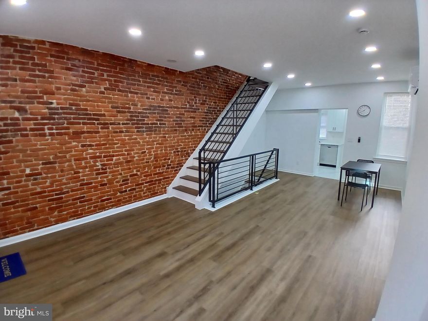 Located on a serene one-way street in vibrant North Philadelphia, this FULLY renovated 2-bedroom, 2-bathroom townhome spans 934 square feet and delivers the perfect blend of modern luxury and city convenience. Enjoy reduced traffic, enhanced privacy, and a tranquil residential vibe that's rare in urban living.
Strategically located just 5-7 minutes from Temple University, 10-15 minutes from bustling Center City, and with seamless access to major highways like I-76 and I-95, commuting is a breeze. You're also a short drive from iconic attractions including the Philadelphia Zoo, expansive Fairmount Park for outdoor recreation, and the renowned Philadelphia Museum of Art district. Nearby public transportation, schools, and shopping options add to the everyday ease and appeal.

Step inside to a bright, open-concept main level boasting stylish luxury vinyl plank flooring, sleek recessed lighting, and a striking exposed brick accent wall that adds character and warmth. The contemporary kitchen is a chef's dream, featuring pristine white cabinetry, elegant quartz countertops, stainless steel appliances, and updated fixtures for both style and functionality.

Upstairs, two spacious bedrooms provide comfortable retreats with ample natural light and modern finishes. A standout highlight is the fully finished basement, complete with its own full bathroom—ideal for a versatile family room, home office, gym, media space, or guest suite. Separate heating systems ensure efficient, zoned temperature control throughout the home, while brand-new electrical, plumbing, and HVAC updates offer peace of mind and long-term savings.
Outside, unwind in your private, low-maintenance rear patio, perfect for grilling, gardening, or al fresco entertaining.

Priced at an unbeatable $190,000, this move-in-ready gem combines premium renovations, a prime location, and thoughtful features, making it an outstanding value for first-time buyers, growing families, or savvy investors. Don't miss this opportunity—schedule your showing today!