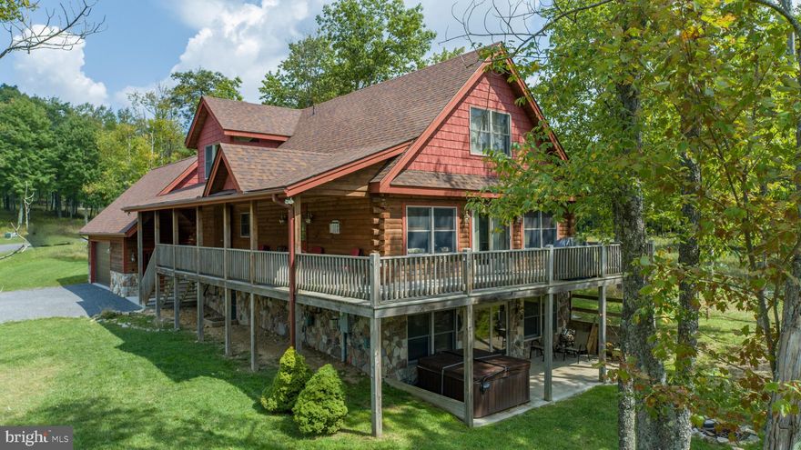 Rustic 5BR log home located atop Wisp ski resort in the Lodestone golf community at Deep Creek Lake! Just minutes to all Deep Creek attractions, this 2017 built vacation home features 3 fully finished levels, granite counters and stainless steel kitchen appliances, an oversized main level primary bedroom with sitting area, 2 fireplaces, wet bar, tankless hot water, an oversized deck with wraparound covered porch,  hot tub, and a 2-car garage with a roughed-in suite. The perfect location for year-round recreation! Established rental. Don't miss your opportunity to view this incredible mountain retreat!