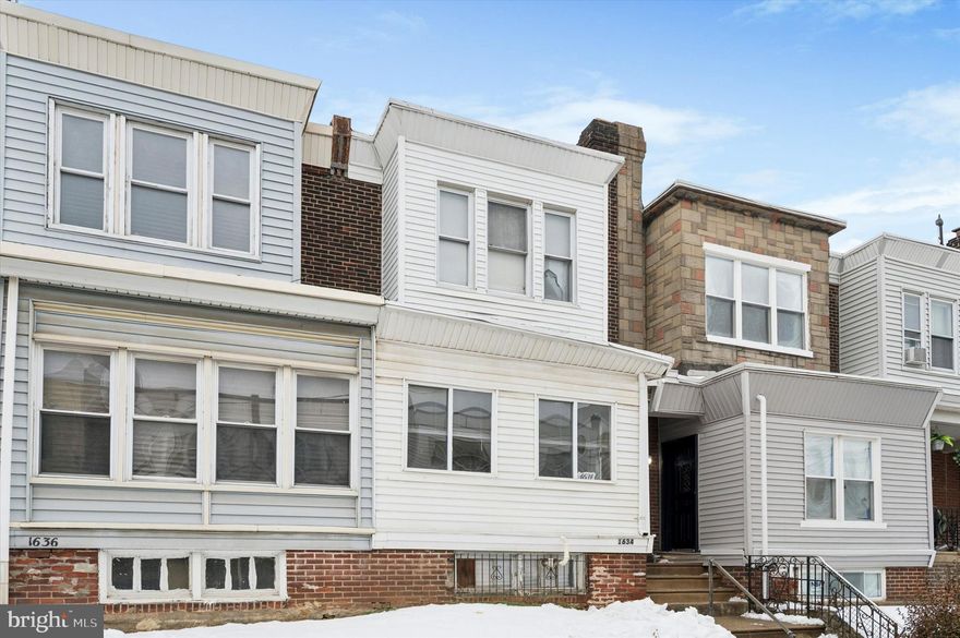 With the cost of living on the rise, you can’t do anything smarter than lock in an affordable mortgage payment–and this move-in ready rowhome on a quiet side street is the perfect candidate. It’s warm and homey thanks to good light and plenty of charming details like all original trim and ornate radiators, and between the large enclosed porch and bright, freshly painted unfinished basement with high ceilings, there’s a ton of flex and storage space. The first floor has extra-wide doorways between the enclosed porch, living and dining rooms, giving it a breezy flow while still maintaining dedicated rooms. The rear kitchen has been updated with stainless steel Frigidaire five-burner range, dishwasher and microwave; there’s good storage space in the white solid-wood cabinets; and sweet details like a pull-out cutting board and original built-in spice cabinet will win your heart. Upstairs, the largest bedroom with a square bay window and great closet space is at the front. There are two more sunny bedrooms and a hall bath, which has a skylight and makes good use of a small footprint with a good-sized double wall cabinet. As a huge bonus, there’s potential for garage parking–just convert the alley service door back to a pulldown and you’re good to go. This neighborly block in a pocket of West Philly that’s rapidly appreciating is convenient to both the Woodland Ave and 52nd St corridors for shopping, dining and public transit, and just a few blocks from Bartram’s Garden.