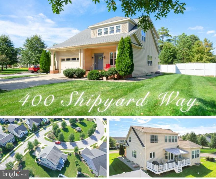 Welcome to 400 Shipyard Way – The Harbours at Solomons Island.  Experience refined coastal living in this exquisite Craftsman-style residence, the former builder’s model home, showcasing superior craftsmanship and every available upgrade throughout. Upon entering, the foyer opens to a private home office, ideal for remote work or study. Continuing down the main hallway, you’ll discover a stunning gourmet kitchen and dining area, featuring 42” maple cabinetry with crown molding and hardware, a custom tile backsplash, granite countertops, center island, built-in pantry, and ample space for a large dining table. The two-story family room flows seamlessly from the kitchen, complete with custom built-ins, a gas fireplace with granite surround and mantle, and access to the rear deck—perfect for entertaining or relaxing outdoors. The main-level primary suite offers a true retreat with a tray ceiling, private access to rear deck, and a luxurious en-suite bath boasting a soaking tub, glass-enclosed walk-in shower, dual-sink granite vanity, private water closet, and a linen closet with convenient pass-through to the laundry room. Upstairs, you’ll find three additional bedrooms, a loft library or reading nook, and a full hall bath featuring a dual-sink vanity and ceramic tile shower. The open-concept overlook to the family room below enhances the sense of spaciousness and light. The finished lower level is an entertainer’s dream, complete with a media room with surround sound, a large recreation area with built-in wet bar, granite countertops, sink, and refrigerator. A fifth bedroom, full bath, and generous storage area with home utilities complete this level.
Exterior highlights include: Lawn irrigation system, Kohler whole-home generator, Expansive rear deck with retractable SunSetter awning, Front brick porch, Extended concrete driveway for additional parking, Extensive hardscaping, Front-load garage with epoxy flooring and automatic openers, Corner lot with one of the largest lawns in the community. Additional interior features include custom window treatments, recessed lighting, transom windows, crown molding package, security system, hardwood, ceramic tile,  plush carpeting, and abundant storage on all levels. Community amenities include a clubhouse, fitness center, swimming pool, community pier for fishing and crabbing, kayak/canoe launch, sidewalks, manicured common areas, and a marina offering discounted boat storage and slips. HOA fees also include personal lawn care, ensuring a truly maintenance-free lifestyle. Located in a 55+ community (with up to 20% of homes available for residents under 55 with other restrictions still applying), this home offers the perfect blend of comfort, convenience, and coastal charm. Enjoy close proximity to PAX River Naval Air Station, Solomons Island, fine dining, beaches, boardwalks, shopping, parks, museums, concert venues, local wineries, and theaters—everything Southern Maryland has to offer.
Every detail of this home reflects the builder’s pride and attention to excellence, making 400 Shipyard Way a true showcase property.
