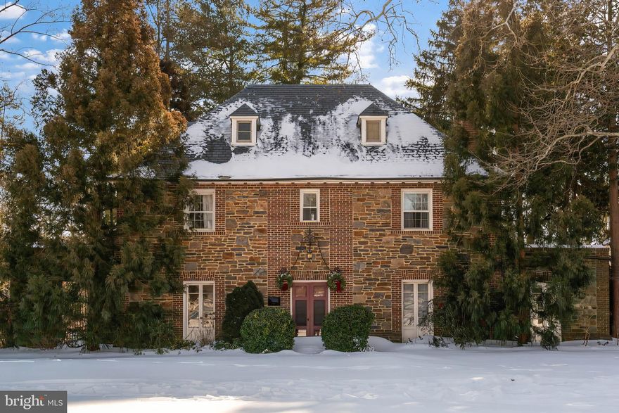 Live authentically. Realize your Guilford aspirations in this Palmer & Lamdin designed French style colonial built by the esteemed Roland Park Company. Ensconced perfectly across from Gateway Park, the property offers its own private back yard haven with a stone patio ideal for both family and entertaining. Allow the formidable façade to speak for itself as the stone and brick accents are continued through the kitchen and sun-drenched dining room. Tradition meets modern convenience in the upgraded kitchen featuring custom cabinetry, an AGA Legacy gas range with paneled fan/hood, granite counters and generous island with seating. The showcase family room boasts original hardwood flooring and a centered wood-burning fireplace between twin French doors leading to the adjacent sunroom office/study. The second floor presents three ensuite bedrooms with a fourth bedroom currently used as a walk-in closet. There are three additional bedrooms and one full bathroom on the third floor. A truly finished lower level expands your living space with a polished concrete recreation room and expansive laundry room with a new washer, two dryers, butcher block counters, and a double sink. Walk to Johns Hopkins Homewood Campus, local museums, restaurants, and shopping. Convenient to Baltimore’s acclaimed private schools. New automatic garage doors. New main sewer line to the street. New sunroom roof and continued biannual slate roof maintenance. New chimney refurbishing/capping. Cultivate your existence. The art of uniting human and home.