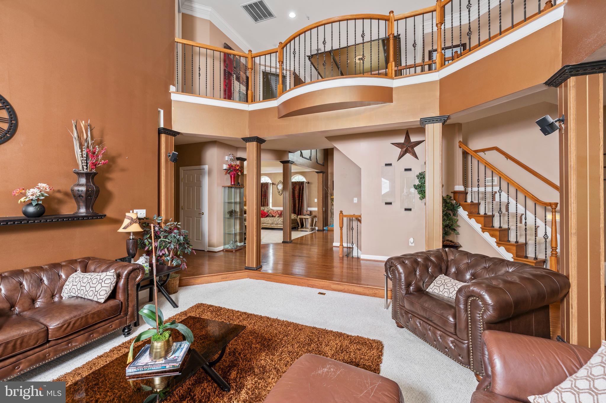 Welcome to 9924 Oxbridge Way, an incredibly impressive colonial that is sure to impress! This 5bd/4.2ba masterpiece offers one of the largest floorplans in Balk Hill. Featuring 10' ceilings on the main level, a two-story living room, a dedicated study that could also be utilized as a main level bedroom, a glass-enclosed conservatory and powder room, the main level is breathtaking and offers stunning features at every turn. With no shortage of space, you'll be able to entertain all of your friends and family, plus all of their friends and family! The living room is bright and sunny and flows directly into the kitchen, which offers a gas cooktop, tile backsplash, island, stainless steel appliances and a butler's pantry. The main level is completed with a laundry room and access to the two car garage. Upstairs offers three spacious spare bedrooms, two full bathrooms for guests and plenty of storage. The primary suite is enormous and provides a spacious footprint for all of your furniture, two walk-in closets and a spa-like ensuite bathroom. Equipped with two vanities, a stall shower, water closet and a soaking tub you could swim laps in, the primary bathroom is a perfect retreat to start or end your day. The basement is the star of the home and offers an additional bedroom, full bathroom, craft room, gym and movie theater! Plus, there is custom bar and rec room for even more entertaining. If you are looking for a home with a major WOW factor, 9924 Oxbridge Way provides exactly that. Stop in today and you will be impressed!!