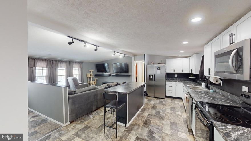 Beautifully updated and remodeled 2 bedroom 2 bath home within walking distance to shopping and dining.
From the roof to the floor, this home has had a makeover including wiring, flooring, bath, kitchen , countertops and appliances.  New 12 x 24 garage,  windows, doors and roof.  Fenced in back yard, front and back deck to sit and enjoy those lazy summer days.  Home has been priced below appraised value.  Don't wait, call today for a showing.