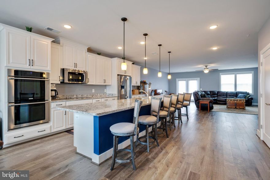 Motivated Seller Nice Price Adjustment.  Best unit in the Neighborhood. Easy Living in the Heart of One Loudoun*Come and enjoy the experience of entertainment just steps away from your comfortable living*One loudoun features many restaurants*Movie Theater where you can enjoy dinner and drinks*Summertime concerts*Shopping*Trader Joes*Indoor Sky Diving*Top Golf*and More*Walkability is a 10*This Beautiful Home features a Roof Top Terrace for your personal Entertainment under the stars*While this home was built in 2017 it was designed with many upgrades*Hunter Douglas Custom Blinds with Remote control main level and master bedroom*Powder room, main level has a Pedestal Sink*Gourmet Kitchen with Stunning Island white Kitchen cabinets (soft close) with under cabinet lighting*kitchen faucet upgraded* kitchen open for entertaining while cooking*Main level Flooring beautiful Hardwood*Bedroom level has the washer and dryer while the master shower includes brushed nickle hydrarail*Recessed Lighting*One Loudoun Living also features Pool,Tennis,Basketball and Volleyball.  Please come and explore Living at its finest without having to drive.