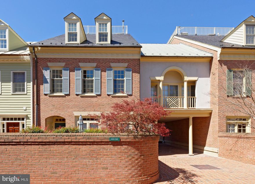 Harborside is a sought-after waterfront community of beautifully designed homes, exquisitely landscaped common areas plus a riverfront walkway.  472 South Union, a pristine townhouse with the finest appointments and millwork offers 4 bedrooms,  4 1/2 baths, gleaming hardwood floors, paneled archways,  deep crown moldings, 2 gas fireplaces with handsome mantels, and beautiful built-ins in the living room, and dining room.  Wider than most townhouses, this lives like a single detached home with a living room, dining room, family room, kitchen and half bath all on the main level.  From the 3 living room windows you look across to greenery at Windmill Park. The kitchen is perfect for the chef with Subzero refrigeration, 2 ovens plus microwave with a gas cooktop. This entire kitchen area opens to the family room in open concept living where sunlight pours through three windows.  A sizable master bedroom suite features a gas fireplace, marble marble en suite bath and custom walk-in closet. The two guest rooms offer white tile baths with long vanities, double closets, and the top floor bedroom features a skylight.  An interior Otis elevator transports you to three levels of living space and to the garage.  A lovely outdoor terrace is surrounded with mature plantings.  Deeded 2 car garage parking conveys.  Park your car, put your groceries right into your own private elevator, push the button and you're on the kitchen level.  This is convenient, easy living in the heart of Old Town, Take a 3D tour - https://tours.linenandlens.com/1579217?idx=1