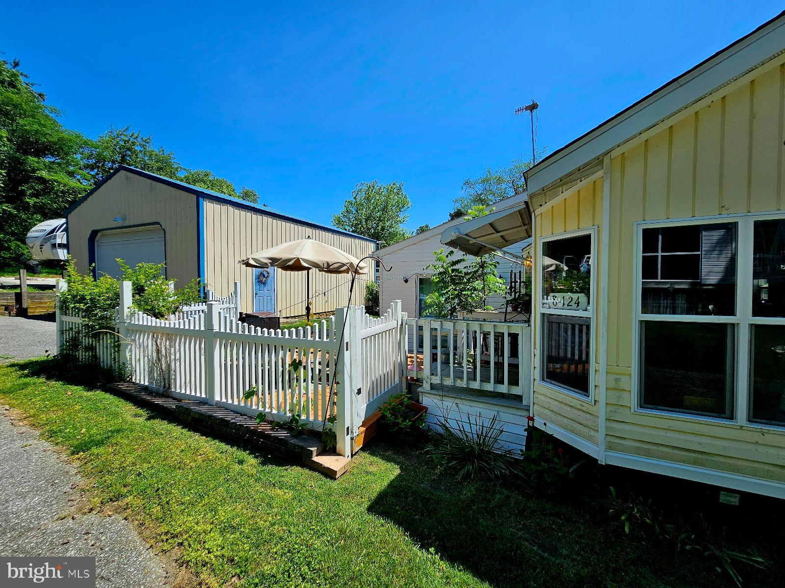 Welcome to your weekend/vacation getaway. Spacious property in located in Indian Acres Campground which is limited to 150 days no more than 100 consecutive days (not a full time residence). Property is in Glen 8 Lots 123, 124, & 125. Large living area, shed 8x8, and Garage 36x26 with 10ft roll up door 6 in poured concrete floor (app 13 years old). Community Amenities include large outdoor pool, large kiddie pool, community room to rent, boat launch, beach, piers, playground, ball fields and many community events. Security Gate and patrol. Just a really nice place.