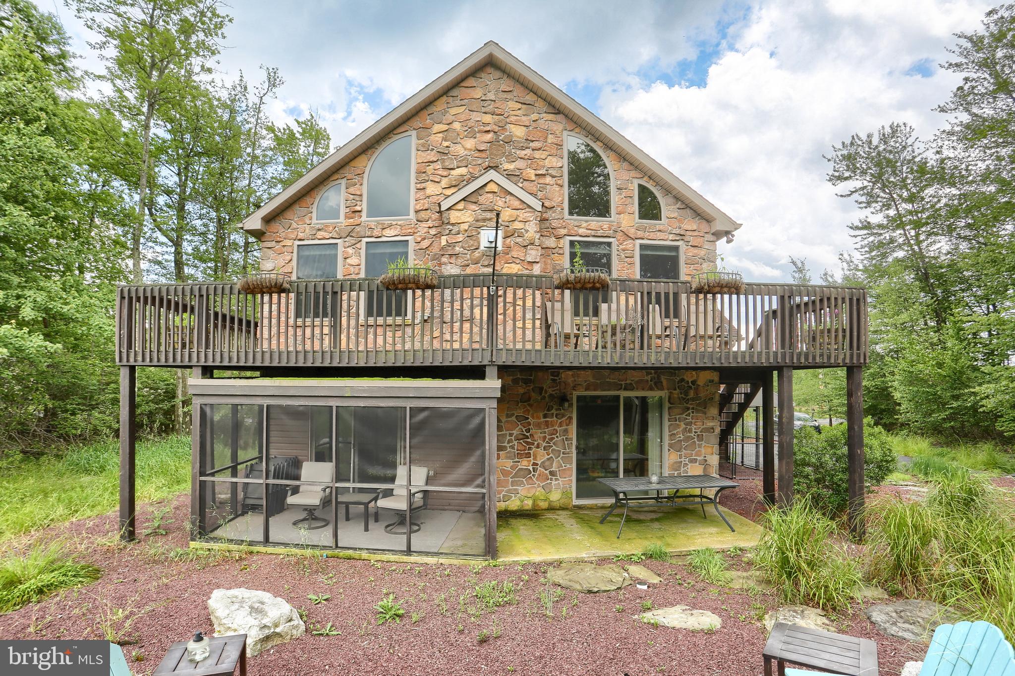 Welcome home to this unique 3 bedroom, 3 bathroom raised A-Frame, located directly on 16th green of the 18 hole golf course! You will enjoy the wrap around deck which offers views of the course as well as low maintenance outdoor picnic space for prime relaxation. Inside your new home, you will find beautifully maintained pine woodwork, an open floor plan and primary level living. Enhance your lifestyle with modern updates, tastefully accompanied with rustic finishings throughout the home. You will find separate living spaces with the lower level offering two bedrooms and a bonus family room. Private access to your screened in porch or direct access to your serene back yead. Don't forget your two car garage for all your storage needs! Enjoy the gated community lifestyle with two golf courses, private ski, indoor and outdoor pools, rec center, private ski mountain, private spa, restaurant on site as well as private hotel. Schedule your showing today!