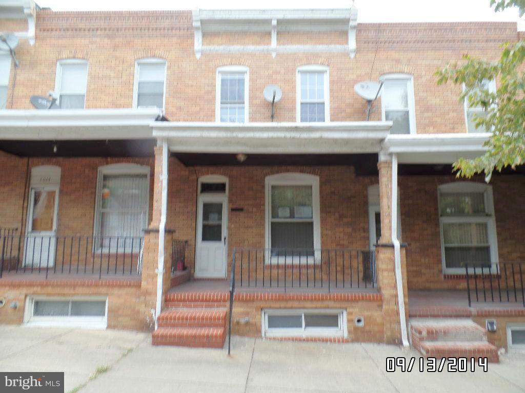 Solid row home features covered front porch, partially finished full basement with full bath provides extra storage and living space. Convenient location near shopping and parks, close to downtown. Buyers must get prequalification from Caliber Home Loans and must be submitted with all financed offers.
