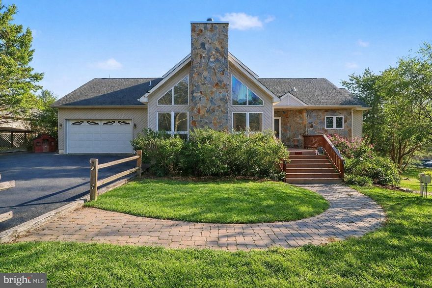 Lake Anna living starts here! Welcome to 6407 Matthew Ln in Kelly’s Landing, a gated community on the public-side of Lake Anna. This fully furnished waterfront home offers 155’ of shoreline, a private beach, and a calm no-wake zone that’s perfect for swimming, paddling, and relaxing away from main-lake traffic. The single-slip covered boathouse offers 6–8’ water depth at the end, so you're able to enjoy a wake boat, pontoon boat, or anything in between.

This home has 4 bedrooms—each with lake views, 3.5 baths, and 3,629 sq ft designed for gathering and unwinding. A stunning stone fireplace with gas logs anchors the living and dining area, while the lake-view kitchen and adjoining living space open to a spacious deck and screened porch for easy indoor-outdoor entertaining. The basement adds even more room to spread out, plus another set of gas logs for chilly nights. Extras like a central vacuum system and FiberLync internet make daily life simple—whether you’re here full-time or escaping for the weekend.

Peace-of-mind updates include an alternative septic system (installed 2021) with 4-bedroom perc. With 2.03-acres, this property delivers space, comfort, and true lake lifestyle. Kelly’s Landing allows short-term rentals, adding flexibility for how you enjoy ownership.

Don’t wait—schedule your private showing today and come feel how easy lake life can be.