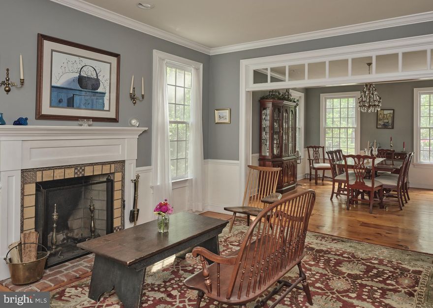 Nestled quietly and perched on a gentle hill, this classic Colonial home offers privacy, space, and charm in one of Bucks County’s most coveted locations. Surrounded by nature on two peaceful acres, the property provides a quiet, private retreat with a newly painted exterior and a layout designed for comfort and flexibility.
The main level, with hardwood floors throughout, offers excellent flow for everyday living and entertaining. There’s a formal living room, a spacious dining room, a cozy sitting room with built-in bar space, and a welcoming family room with a fireplace and high windows that fill the space with natural light. The kitchen features a Jennair gas stove and oven, custom vent hood, KitchenAid dishwasher, a center island, and a walk-in pantry, offering functionality and efficiency for daily use. A powder room, laundry room, and access to the rear deck complete the first floor.
Two staircases - one formal and one from the back of the house - lead to the upper level, where you’ll find four generously sized bedrooms, including a primary suite with walk-in closet and ensuite bath. The three additional bedrooms share a full hall bath. The lower level is partially finished, offering bonus living space, a workshop area, and plenty of storage.
Outside, the tranquil backyard includes a generous deck, garden spaces, room for play and entertaining, and wooded pockets ideal for exploration and quiet moments surrounded by nature. 
Lovingly maintained and full of potential, this is a solid home with room to grow - bring your creative vision to cosmetically refresh the interiors and make this Solebury gem your own.