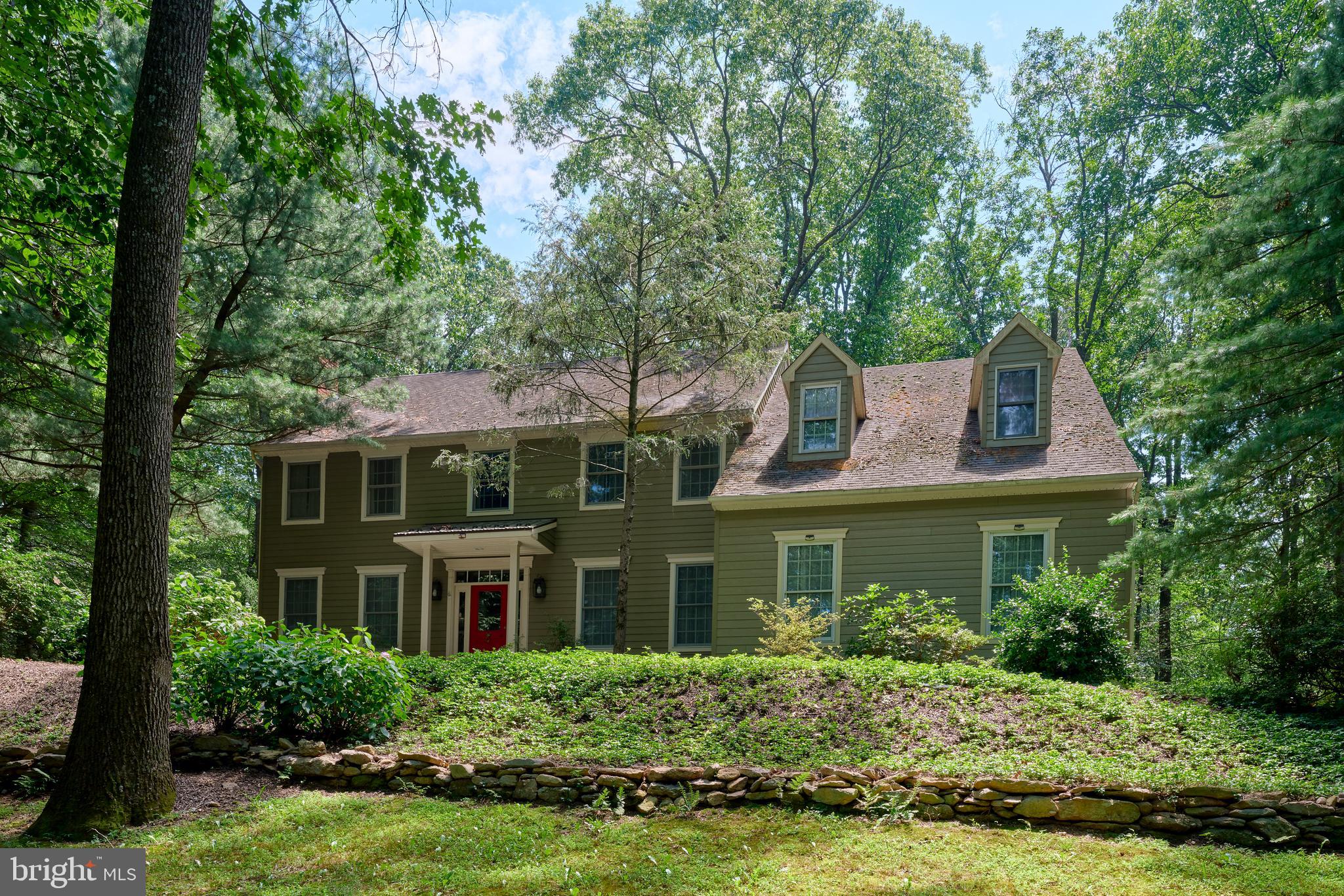 Nestled quietly and perched on a gentle hill, this classic Colonial home offers privacy, space, and charm in one of Bucks County’s most coveted locations. Surrounded by nature on two peaceful acres, the property provides a quiet, private retreat with a newly painted exterior and a layout designed for comfort and flexibility.
The main level, with hardwood floors throughout, offers excellent flow for everyday living and entertaining. There’s a formal living room, a spacious dining room, a cozy sitting room with built-in bar space, and a welcoming family room with a fireplace and high windows that fill the space with natural light. The kitchen features a Jennair gas stove and oven, custom vent hood, KitchenAid dishwasher, a center island, and a walk-in pantry, offering functionality and efficiency for daily use. A powder room, laundry room, and access to the rear deck complete the first floor.
Two staircases - one formal and one from the back of the house - lead to the upper level, where you’ll find four generously sized bedrooms, including a primary suite with walk-in closet and ensuite bath. The three additional bedrooms share a full hall bath. The lower level is partially finished, offering bonus living space, a workshop area, and plenty of storage.
Outside, the tranquil backyard includes a generous deck, garden spaces, room for play and entertaining, and wooded pockets ideal for exploration and quiet moments surrounded by nature.
Lovingly maintained and full of potential, this is a solid home with room to grow - bring your creative vision to cosmetically refresh the interiors and make this Solebury gem your own.