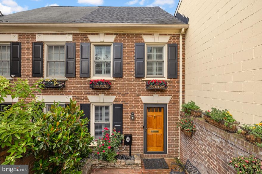 A Truly Unique Blend of Timeless Elegance and Modern Luxury

Step into this one-of-a-kind, sun-drenched townhome that masterfully blends traditional charm with contemporary sophistication. From the moment you enter, you’ll fall in love with the dramatic soaring-ceiling atrium crowned with skylights, bathing the space in natural light. Warm brick flooring and an exposed brick wall add character and texture, creating a welcoming and stylish ambiance.

Designed for both everyday living and elegant entertaining, the custom chef’s kitchen is a culinary dream, featuring top-tier appliances including Gaggenau, Sub-Zero, and Miele, paired with custom inset cabinetry and refined finishes. Adjacent to the kitchen, the dining room exudes charm and functionality with built-in banquette seating, bay window, and custom built-ins ideal for displaying fine china or art.

The luxurious primary suite offers a peaceful retreat with cathedral ceilings, generous storage and an elegant ensuite bath featuring custom tile work, a soaking tub, walk-in shower, and dedicated makeup area. A versatile loft space is perfect for a home office, yoga studio, or for your Peleton. Two additional spacious bedrooms share a beautifully updated bath with a walk-in shower.

Additional highlights include beautiful moldings, convenient second-floor laundry room, private front and rear patios with extra storage. Enjoy easy parking on the charming brick driveway.

This extraordinary home is just steps from parks, grocery stores, acclaimed restaurants, retail, King Street, Reagan National Airport and the scenic waterfront.

A rare opportunity to own a truly exceptional residence that combines timeless design with modern living in one of the area’s most desirable locations.