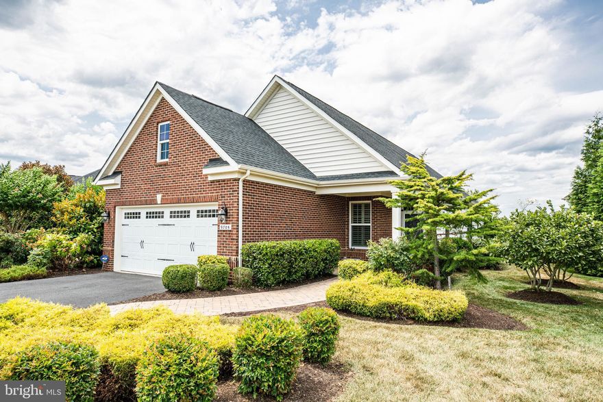 Be first in line to see this outstanding former Belle Grove model home!  Stylish and modern, this "Cottage" style home with 2 car garage is just perfect for Downsizers offering  wonderful living areas both inside and out.  Outside you'll enjoy beautifully manicured grounds, lush landscaping, private rear covered porch and patio all adjacent to common area with Gazebo.  The wide front covered porch makes a big statement as you enter the comfortable entertaining area with gas fireplace, plantation blinds, Dining Area with designer lighting  and  Den off the main living area.  Owners Suite offers upgraded tile and seated shower and Guest Bedroom has large closet and adjacent bath.   Enjoy a fabulous private view from the Kitchen while enjoying stunning stone backsplash, granite counters and stainless appliances.  Exit the Kitchen and enjoy your covered porch and favorite beverage while relaxing in  privacy listening to birds.  Make an appointment today to see this rare cottage home today before it's gone! HOA includes FIOS cable & Internet.