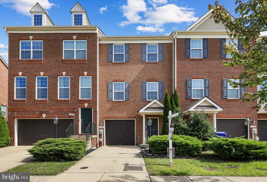 This beautiful townhome residence has over 1,700 sqft, 3 bedrooms, and 2.5 baths, with a gorgeous brick facade. The spacious floor plan features airy lighting, a deck overlooking lush greenery, and an attached single-car garage. An eat-in kitchen is open to the living room and perfect for hosting with a center island, and entry to the deck. The primary bedroom features a large closet and an en suite bath with dual vanity. Enjoy the community pool and walkable paths while being minutes away from retail shopping.