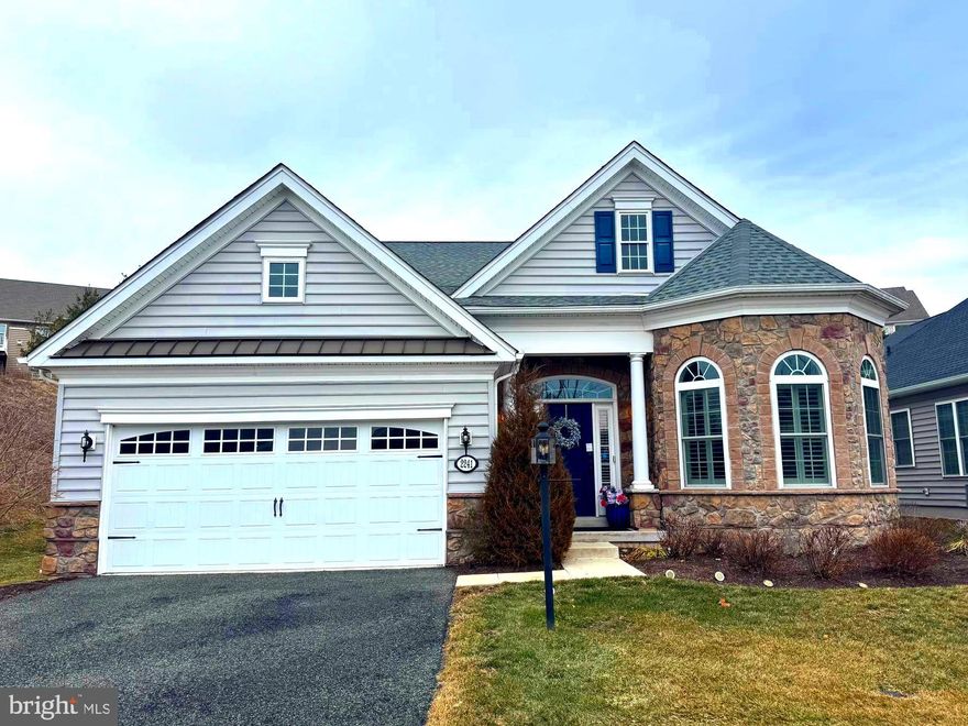 Welcome to this beautiful home built in 2019 in the highly desired Meadow Glen Community, sitting on a private lot equipped with a 2 car garage that includes an oversized storage area. A thoughtfully designed layout begins with a soaring foyer to set the tone, complemented by a sun-filled office or flex space just off the entry. The main level flows seamlessly from a formal dining room into a stunning kitchen featuring high ceilings, an oversized island, large pantry, and a charming breakfast area—perfectly flowing to the expansive living room with cathedral ceilings. The main-floor primary suite is a true highlight, freshly painted and complete with a spacious walk-in closet and a luxurious en-suite bath with double vanity. A second generously sized bedroom, full hallway bathroom, laundry room, and additional living space complete the first floor. Upstairs, enjoy an open living room overlooking the foyer, another large bedroom, full bath, and ample storage. Step outside through the slider to a covered patio ideal for relaxing mornings or peaceful evenings. With a vibrant association that covers your lawn maintenance, snow removal, trash, and many other exceptional amenities, this home is just the beginning.