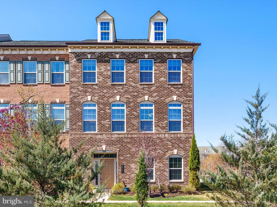 This stunning brick front "Executive townhome" is one of only four sought after end units in Parkside that offer the rare combination of four levels, two decks, and a two-car garage. Thoughtfully upgraded and impeccably maintained, this home boasts a brand-new kitchen refresh and new luxury vinyl plank (LVP) flooring on the main level.

Step into the welcoming entry foyer, which opens to a spacious family room.  Extra storage with two entry-level closets, a convenient powder room (featuring plumbing rough-ins and space for an optional tub), and direct access to both the two-car garage and two-car driveway.  The garage offers built-in storage, and an electric car charger!  

The main level showcases style and functionality, highlighted by a beautiful kitchen with newly transformed 42" cabinetry and premium appliance upgrades, including a five-burner gas cooktop, the expansive center island, along with a walk-in pantry. The living room features custom built-ins, a gas wall-mounted fireplace, and a live-edge barn wood mantle.  Sliding glass doors lead to the low-maintenance composite deck with vinyl railings.  Opposite the kitchen, the formal dining room offers space for a large table, and easy access to a powder room.

The bedroom level boasts a primary suite complete with a luxury en-suite bathroom and a customized walk-in closet by California Closets. Two additional nicely sized secondary bedrooms share a full, hallway bathroom.

A rare and highly desirable fourth level offers a versatile two-tiered space—ideal as a bedroom, home office, or recreation area—along with a private full bathroom, a generous walk-in closet, and direct access to the private rooftop terrace, perfect for relaxation or entertaining.

Additional highlights include fresh paint, brand-new HVAC systems for both zones, a tankless water heater, newer entry-level carpet, and upgraded main-level flooring.  Don't miss the opportunity to tour this one-of-a-kind gem in Parkside.