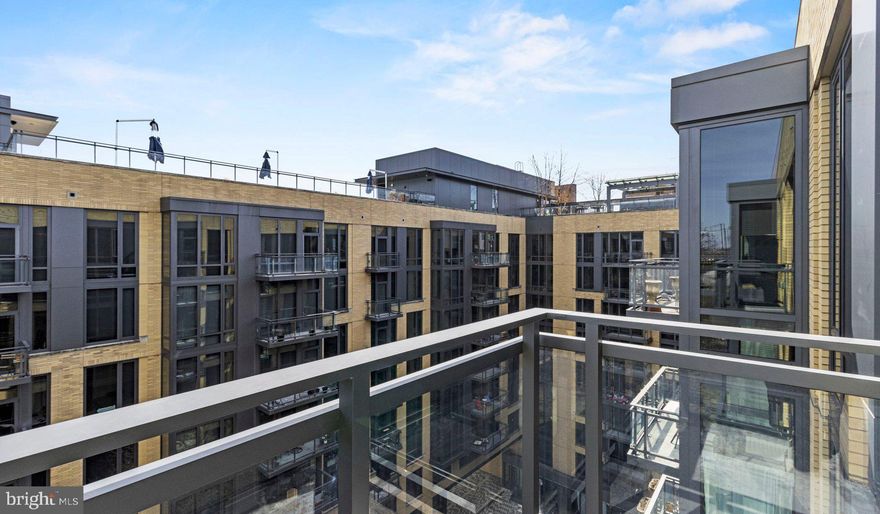 Nestled in the vibrant heart of Bethesda, Maryland, this luxury apartment complex offers an unparalleled living experience that combines modern convenience with sophisticated design. Designed to cater to the discerning tastes of urban dwellers, this property stands as a testament to luxury living, where every detail has been meticulously crafted to ensure the utmost in comfort and style.

*Exceptional Location*
Located in the sought-after Woodmont district, the apartment complex is perfectly positioned as a gateway to the best that Bethesda has to offer. Residents enjoy easy access to a plethora of amenities, including the Walter Reed National Military Medical Center, the NIH, and a variety of shopping, dining, and entertainment options. The prime location also offers convenient access to public transportation, making it easy to explore the wider metropolitan area.

*Architectural Elegance and Design*
The building's U-shaped design opens up to a beautifully landscaped courtyard, offering a seamless transition from the bustling city life to a tranquil oasis. The architecture is both richly textured and humanly scaled, creating an inviting streetscape that residents are proud to call home. A dramatic window wall façade and ground-level duplex units with front porches and planters further enhance the building's aesthetic appeal.

*Luxurious Amenities*
Residents of this apartment complex enjoy access to an array of exceptional amenities designed to enhance their lifestyle. The property boasts a large fitness center, fireside lounges, and a rooftop lounge equipped with bars, fireplaces, grilling areas, and two pools. Additionally, the convenience of having a 50,000 square foot grocery store within the building cannot be overstated. The property is also LEED Gold Certified, reflecting a commitment to environmental sustainability.

*Sophisticated Living Spaces*
The apartments themselves are a reflection of the luxury and sophistication that define the property. With a variety of floor plans, including studios, one to three-bedroom apartments, and townhomes, there is something to suit every preference. Each unit features designer finishes, stainless steel appliances, and spacious layouts that make coming home a pleasure.

*Community and Convenience*
The property is known for its friendly and helpful staff, ensuring that the needs of residents are met with professionalism and care. The well-maintained common areas and the sense of community fostered among residents make this complex more than just a place to live—it's a place to belong.

This luxury apartment complex in Bethesda, Maryland, offers an unmatched living experience for those seeking the best in urban living. With its prime location, architectural elegance, luxurious amenities, and sophisticated living spaces, it stands as a beacon of modern luxury and convenience. Realtors and renters looking for a property that combines the vibrancy of city life with the comfort of upscale living will find everything they desire and more at this premier apartment complex.

** Pricing and availability subject to change on a daily basis ** Photos are of model units ** Parking may be available for additional fee **