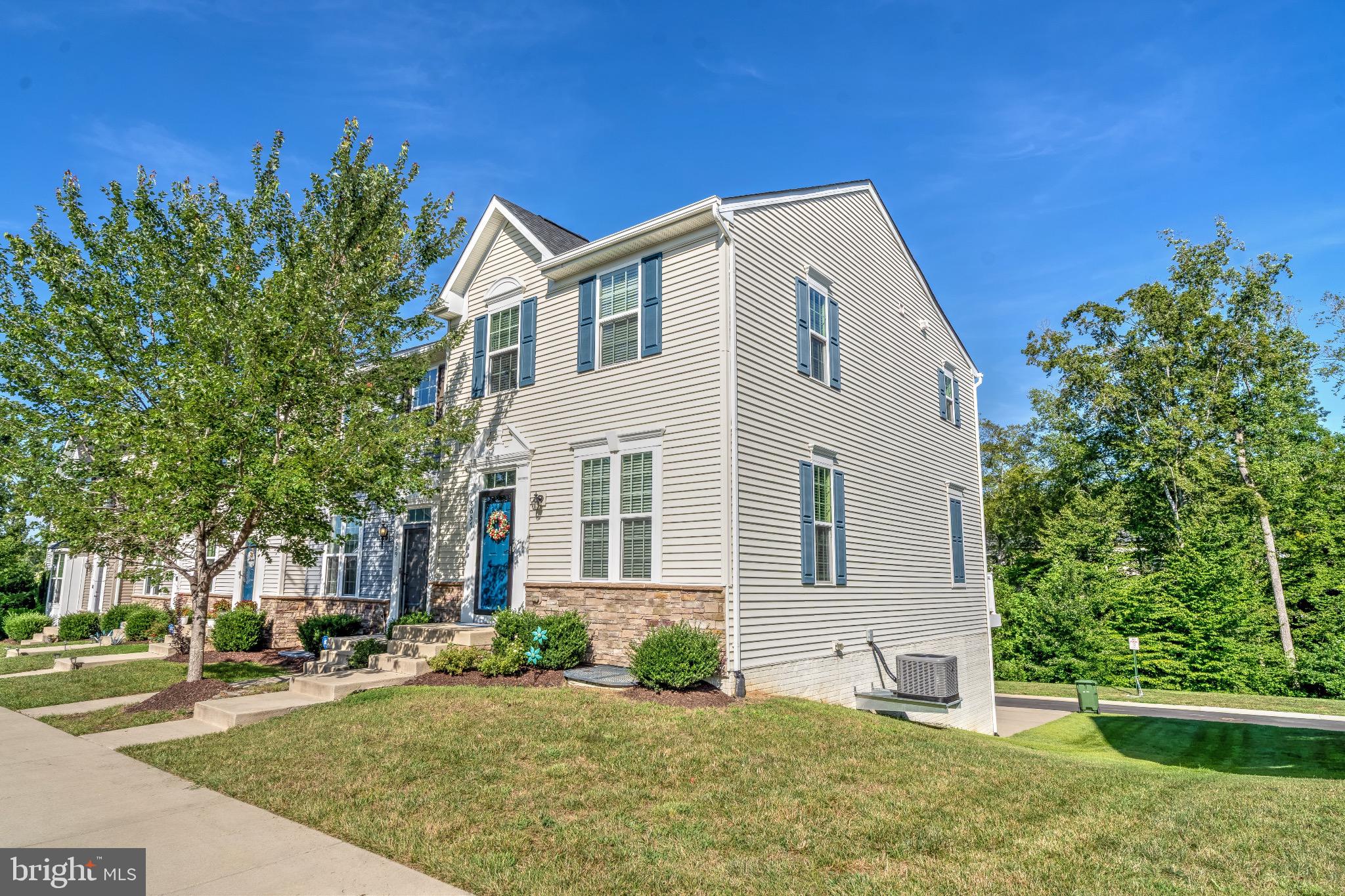 Nestled in the charming community of The Village at Courthouse Commons, this exquisite end-of-row townhouse offers a perfect blend of luxury and comfort. Built in 2017, this residence boasts a traditional architectural style, enhanced by its excellent condition and thoughtful design. Step inside to discover an inviting open floor plan that seamlessly connects the gourmet kitchen, dining area, and family room. The kitchen is a culinary enthusiast's dream, featuring a spacious island, built-in microwave, and high-end appliances including a refrigerator, electric oven/range, dishwasher, and disposal. Recessed lighting casts a warm glow over the space, creating an ambiance that is both sophisticated and welcoming. The main level is designed for both entertaining and everyday living, with a dining area that flows effortlessly into the family room, perfect for gatherings or quiet evenings at home. The layout is enhanced by a combination of functionality and style, ensuring that every corner of this home feels inviting. Retreat to the luxurious primary suite, complete with a walk-in closet and a beautifully appointed primary bath featuring a stall shower. Two additional bedrooms provide ample space for guests or a home office, while a convenient half bath on the main level adds to the home's practicality. The partially finished walkout basement offers additional living space and garage access, making it ideal for storage or a future recreation area. With an attached two-car garage and a concrete driveway, parking is both convenient and accessible. Step outside to enjoy the community amenities, including a sparkling outdoor pool, clubhouse, and well-maintained common grounds. The association takes care of lawn maintenance, snow removal, and trash services, allowing you to spend more time enjoying the lifestyle you deserve. This property is not just a home; it's a lifestyle choice that combines luxury living with the comforts of a close-knit community. Experience the perfect blend of elegance and ease in this stunning townhouse, where every detail has been thoughtfully curated for your enjoyment.