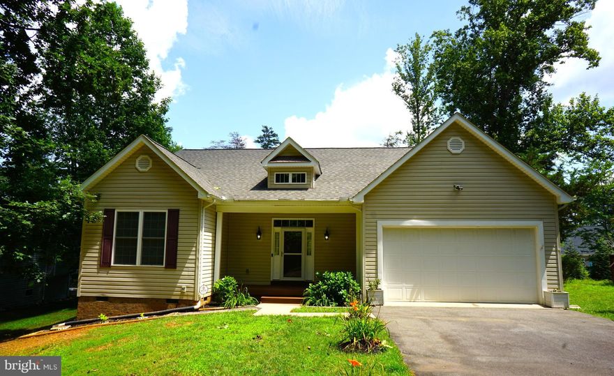 Welcome to this cozy, beautifully designed open concept rambler boasting 9ft ceilings & gorgeous cathedral ceilings. Home features several upgrades including hardwood flooring, ceiling fans, recess lighting, lots of counterspace, built ins, white kitchen cabinets, Stainless Steel appliances, brand new carpeting, radon remediation system, fully encapsulated crawl space, new lighting, custom fireplace mantle, fruit bushes, and the list goes on & on! Large two car garage with room for storage. Large deck & yard for entertaining. Bonus Room for an office, dining room, gym, or guest room.  Upgraded baths with granite counter tops & primary spa-like bathroom with soaking tub and beatifully tiled shower, as well as an extensive walk in closet. Lake of the Woods is a premier Lake Community with two lakes, a golf course, an equestrian center, fire and rescue services, Olympic sized pool, boating, water skiing, kayaking, golfing, biking trails, a clubhouse, parks, beaches, basketball courts & many community events to join. Come see what all the excitement is about living at Lake of the Woods!!