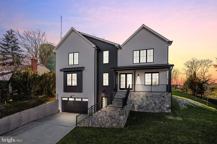 Nestled in the heart of Falls Church, this newly constructed contemporary home is a masterpiece of design and craftsmanship. Spanning over 5,552 square feet of luxurious living space, this property features 9’ ceilings across all three levels, hardwood floors on the upper two levels and luxury vinyl plank on the lower level. The main level hosts a family room and modern gas fireplace with custom surround, setting a warm, inviting atmosphere.  The kitchen is a chef's dream, with Designer Series Maple Cabinetry, high-end quartz countertops, a 10-foot center island, and a suite of Jenn-Air stainless-steel appliances. The butler’s pantry and walk-in pantry provide ample storage and convenience. The dumbwaiter elevator allows for ease when bringing in groceries and other items from the garage. You can expand your living space by opening the ten foot wide sliding glass doors to the spacious Trex deck. The separate large dining room is perfect for hosting all your family gatherings. Features include custom wainscoting, a tray ceiling and oversized windows that bring in abundant natural light.  Off the main entrance you will find the perfect home office with glass french doors.  This space can also be used as a main level bedroom as it features a full bathroom and walk-in closet.  The main level is finished with the perfect adult clubroom space.  Enjoy coffee and a book or cocktails with friends. 
The oak staircase with modern cable railings leads to the upper level with the primary bedroom and three additional spacious bedrooms, each boasting their own en-suite bathrooms and walk-in closets, ensuring ample privacy and convenience for residents and guests alike. Delta Shower systems, designer tiles, and maple vanities in all bathrooms set a standard of luxury. The primary bathroom showcases a custom design with dual sinks, a free-standing tub, and a modern barrier-free shower. The second-floor laundry room features washer/dryer hookups and built-in cabinetry with quartz counters. The home is illuminated by recessed and overhead lighting in all rooms, with bedrooms pre-wired for ceiling fans, ensuring comfort and convenience.
The finished basement includes a large family area, fitness room, and a bedroom suite with a walk-in closet and full bathroom. This home is equipped with two 40-gallon water heaters and an advanced insulation package, ensuring energy efficiency.  The garage is equipped for electric vehicle charging, highlighting the property's modern amenities. 
The home's exterior is adorned with James Hardie - Lap Siding with ColorPlus Technology, complemented by a 30-Year Architectural Roof Shingles and striking Metal Roof Accents. Pella Windows frame the property, ensuring durability and style, while oversized 6-Inch Aluminum Gutters and downspouts, along with an interior and exterior foundation drain system with sump pump.  This contemporary luxury home combines state-of-the-art features with meticulous attention to detail, offering an unparalleled living experience.