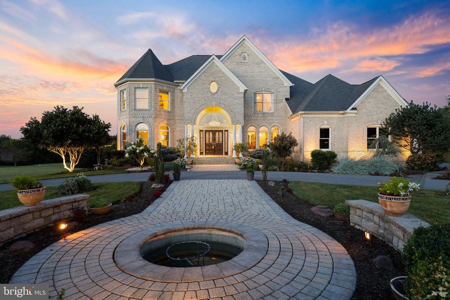 Travel the circular drive to this perfectly situated on a landscaped 3.45 acre homesite and expertly
designed 8,300 sq ft custom French colonial manor known for its style and quality use of the finest
materials available in its construction. This stunning residence displays freshly painted interiors, immense character and curb appeal, brick clad exteriors and nestled gables that grab your attention as you prepare to enter the eloquent hardwood two-story foyer hosting a design inlay, curved staircase, and gorgeous crystal chandelier hanging from a tray ceiling. Elegance flourishes throughout this home showcasing profile crown moldings, high ceilings, wainscoting, modern lighting, and a well thought out design creating an ideal space for small intimate get-togethers as  well as grand celebrations full of style and grace
Exteriors present a tiered Trex® deck, a paver walkway to a pergola, open yard, pond views, extensive
hardscape, and a paver patio with retaining sitting walls and a built-in outdoor kitchen and firepit
Centrally located between the Baltimore and Washington metro areas, near commuter routes, near
airports, shopping, and more!