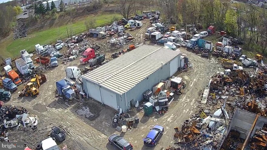 For sale is a 3.95-acre salvage yard with heavy duty truck and towing parts. All equipment and inventory currently on the property is included with the sale. A 2100 sq ft 3 bay garage with full electric service suitable to do any sized truck repairs sits in the middle of the property. This property is ideal and suitable for a business that wants a great location that will specialize in standard towing, roadside assistance, heavy-duty towing, vehicle hauling, accident recovery, emergency spill response, undocking, vehicle repairs, etc. The location is great as a central artery for a large trucking business and can be also used as a distribution center. To view the property and all inventory included in the sale, please schedule an appointment. This property isn't for everybody but for the right person it will be a goldmine.