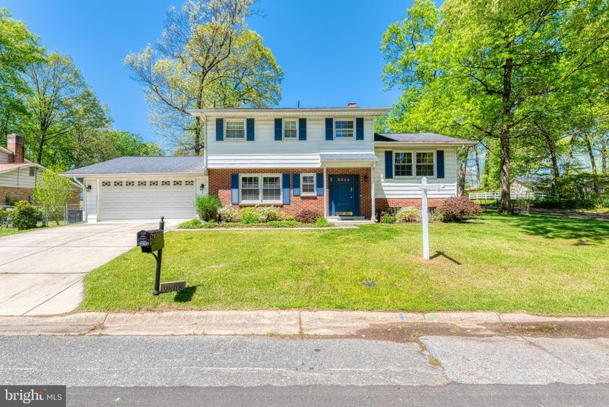 Unique, lovingly maintained 4BR/2.5BA on a fenced corner lot with over-sized 2 car garage. Pull into the over-sized 2 car attached garage (including electric sub-panel for tinkerers) and unload your groceries right into the adjacent, updated kitchen. Kitchen includes white cabinets offering tons of storage, stainless steel appliances incl. gas stove, gorgeous granite countertops, and peninsula. There is plenty of room for a full size dining table in the open concept dining room as well as additional cabinet storage/bar area. The first level family room - located in the massive addition with vaulted ceiling - includes an efficient wood burning stove with brick surround and sliding doors offering access to paved rear patio and fenced rear yard. The main level also includes a convenient half bath, formal dining area/flex space with chair rail and recessed lighting, and laundry. The second level offers a spacious living room with cozy gas fireplace anchored by 2 large windows providing tons of natural light. The third level includes 4 ample bedrooms, 2 hallway closets, and 2 bathrooms. The hallway bathroom is complete with shower/tub combo. Master suite includes master bathroom containing custom standing shower with tile surround and glass door. Plenty of storage throughout including unfinished basement containing utilities. 2-zone heating and cooling offers rapid climate control and savings on utilities; previous owner enjoyed using wood stove on first level in lieu of central heat to keep the entire home extra toasty each winter. Home includes modern, fresh paint and gleaming hardwood floors throughout - don't miss!
