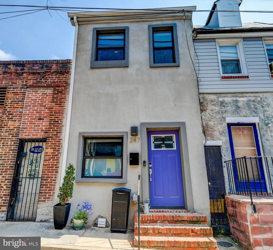 FABULOUS FIND - Chic, 2 BR, 2.5 Baths, 1200 Sq. Ft., Industrial, SMART, row home!  Located on the historic Upper Fells Point Lady Day Way (the street where Billie Holiday once lived) filled with picturesque murals. This contemporary 2 bedrooms/ 2.5 bath home is an open concept with high ceilings and recessed lighting throughout. It has an industrial vibe with features like exposed ductwork, wide-plank flooring, and an iron railing staircase with warehouse pendant light fixtures. You can cozy up in the living room to the electric fireplace and mantel. On the split level, walk up to the giant kitchen with stainless steel appliances, a large island, and granite countertops. There is also a dining space and half bath located on the main floor. Upstairs is the master suite with vaulted ceilings, walk-in closet, balcony, and a dual vanity bathroom with a large shower and two shower heads. Also featured on the upper level is a second spacious bedroom with two closets, another full bathroom, and frontload washer and dryer. Control this smart home simply through your mobile device with the Ring doorbell (a video security system), the Wink (controls lighting and locks), and the Nest (energy saving thermostat) all ready to be used. Not to mention a parcel box outside to conveniently receiving packages   perfect for urban living. Close walk to Fell Point, Patterson Park, Johns Hopkins, and great local restaurants. This is a must-see house for a great price!
