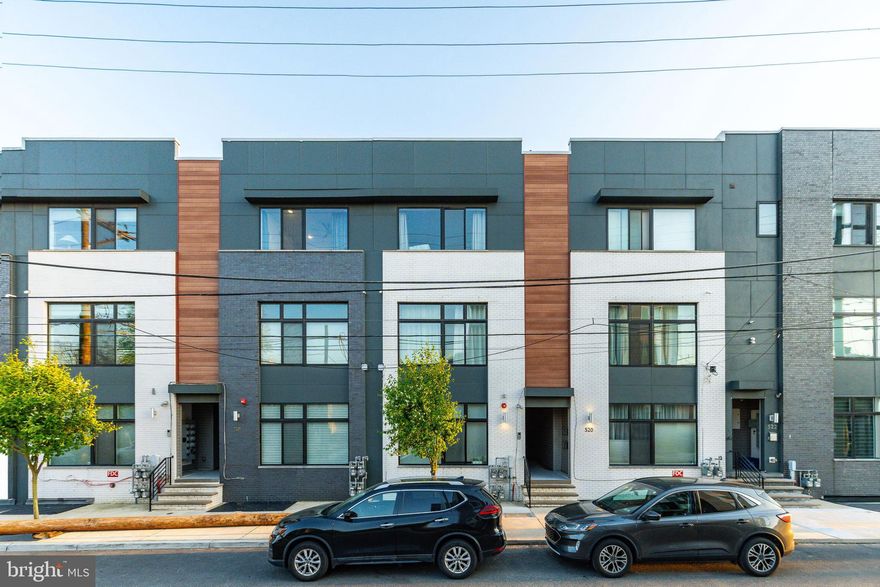 With about 5 years remaining on the tax abatement, this oversized modern unit delivers a great mix of space, style, and practicality. You can enter through the shared hallway or take advantage of your own private rear entrance, which opens into a bright, airy living and dining area with dark hardwood floors and a true open-concept layout. The living space is generously sized, giving you plenty of room to set up a full seating area without feeling tight, and the natural light really makes it feel inviting and comfortable. It flows seamlessly into the kitchen, making it an ideal setup for everyday living or entertaining. The kitchen itself is built for both cooking and hosting, featuring quartz countertops, a large island with seating, and plenty of cabinet space for storage.

Downstairs, you’ll find high ceilings throughout, along with a Samsung washer and dryer, a nicely sized first bedroom with an egress window and walk-in closet, a full hall bath and linen storage. The second bedroom serves as generous primary suite complete with a built-in closet, french doors leading to an outdoor space, and its own full bathroom. Tucked away in the rear of the building, the unit offers a quiet, private feel, with southern exposure bringing in great natural light all day.

From an investment standpoint, this property checks a lot of boxes—remaining tax abatement, strong rental demand, and steady appreciation in the area. The location puts you right in the mix, with easy access to shopping, restaurants, and public transit, plus you're just a short walk to Fishtown, Temple University, Northern Liberties, and the Market-Frankford Line at Berks Station.