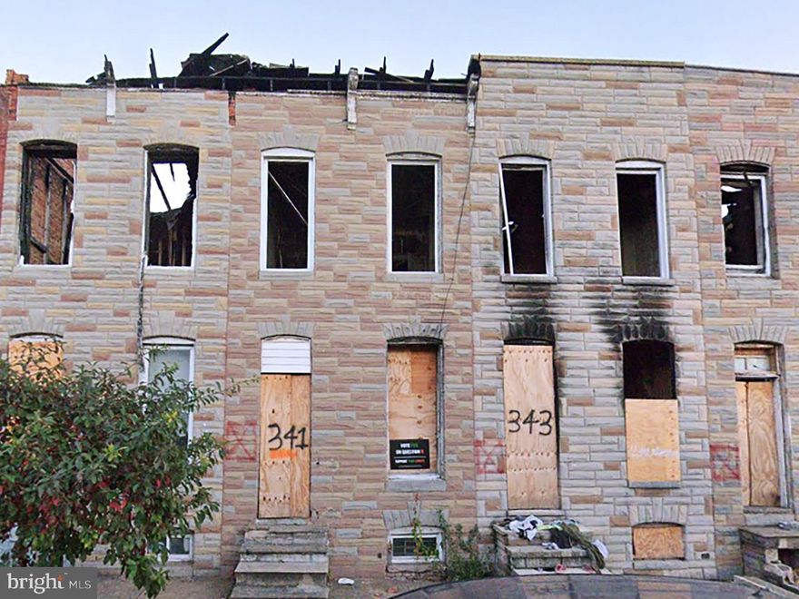 POST AUCTION: MAKE AN OFFER! Deposit: $5,000.

This two-story townhouse at 341 S Fulton Ave in Baltimore's Mount Clare neighborhood is a boarded, fire-damaged shell in need of total renovation. The property is within +/- 1 mile of Carroll Park, a 117-acre green space offering various recreational facilities. Major traffic routes nearby include S Monroe Street and S Fulton Avenue, providing access to downtown Baltimore and surrounding areas. Public transportation is available via LocalLink bus routes. The property is currently vacant.