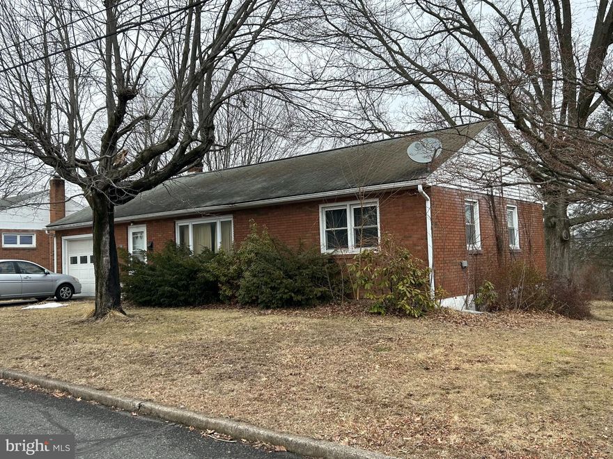 Brick Rancher ready for the new owner to make it their own. the walk out basement with concrete steps from the garage has a full bath roughed in and ready to finish.
