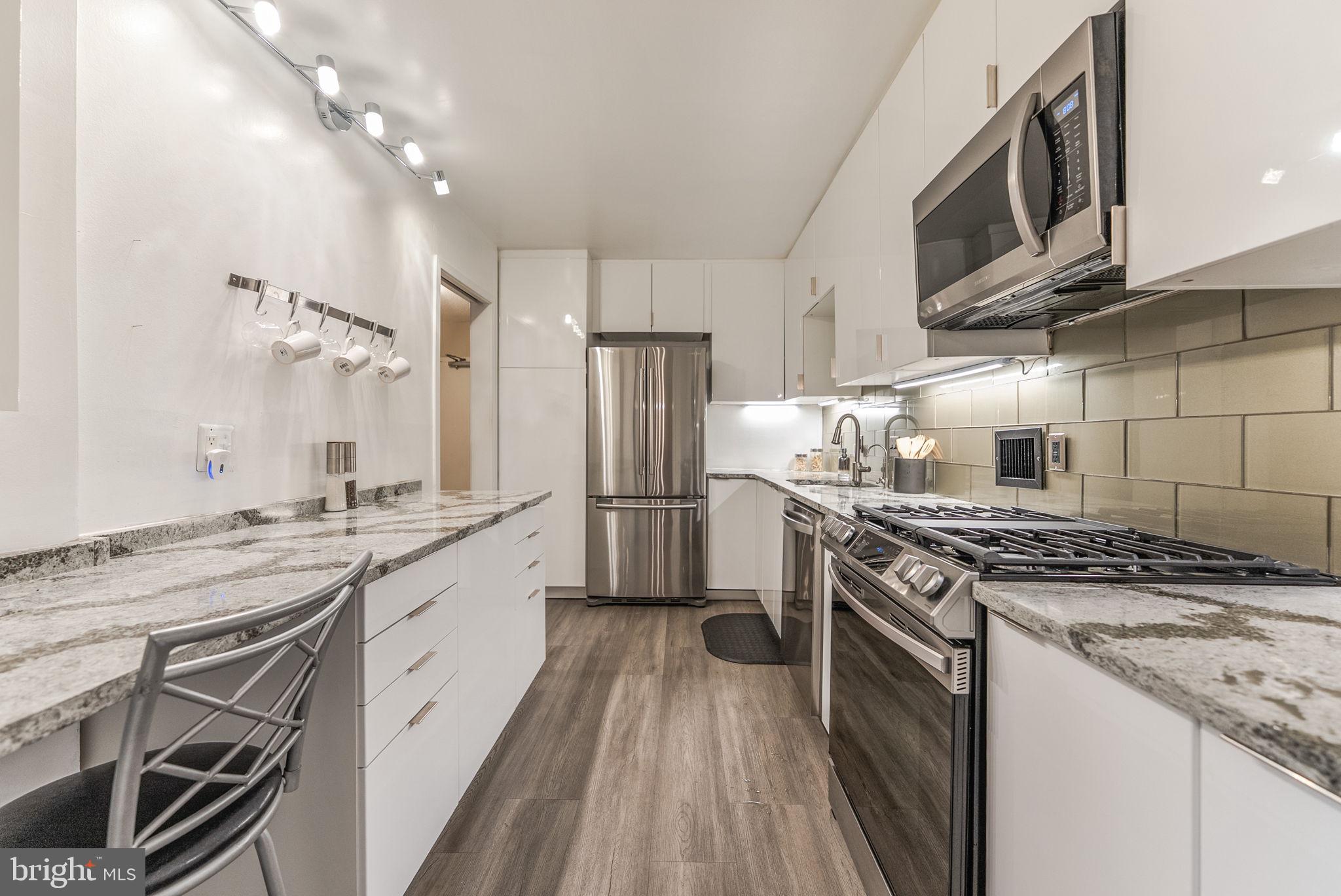 Welcome to a one-of-a-kind unit in The Willoughby. Kitchen was designed with functionality + beauty in mind. Shiny finish cabinets not only sparkle, but are easy to clean . Every imaginable feature included: large lazy Susan corner cabinet, spice drawer, pullout drawers are sufficiently deep for large pots and pans and easy on your back! Under-counter filter for water eliminates need to buy bottled water. Extra-large Samsung fridge has bottom freezer and excellent capacity. Other stainless appliances include 3-level dishwasher and 5-burner gas stove. Wall cabinets are not only tall, but deep enough for your platters and large plates. Luxury Vinyl Tile completes this thoughtfully planned out kitchen. Sliding doors keep odors in and work space out of sight. Additionally, there is an area in the kitchen where you can drink your morning coffee while you catch up on emails. The patio is at least as large as the living room. Current owner has planted azaleas that bloom in Spring and Fall, but it is yours to landscape as you wish. Great private entertaining area right off the living room, but viewable from the bedroom as well as the den/guest room/office which is a welcome feature in a one-bedroom unit. Blinds in the bedroom are adjustable to block light or not. Generous closet space throughout. Additional storage room on the 8th floor holds up to 5 of your extra items (suitcases, seasonal decorations). Gas, electricity, water, master insurance included in condo fee. The chandelier in the dining area DOES NOT convey. The building has 24/7 concierge, a book club, speaker series, activities on the rooftop from time to time. In addition to the pool, there is a sundeck, library and rooftop lounge with open wi-fi. Current projects include garage updating and installation of fire alarm. The building has bike storage. Additional bonus to this unit: two parking spaces included on level G4 right across from the North elevators. Tandem spot.If you don't need both spots, you can rent them out. Seller is licensed real estate agent.