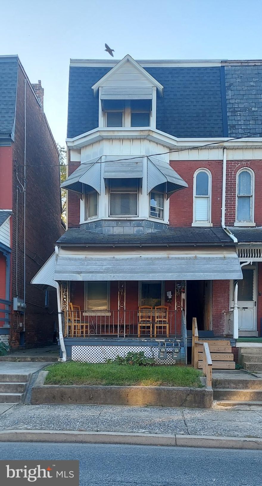 Great 2 unit on the end of the row with two off street parking spaces. This home, recently made vacant is waiting for two new tenants or ready for your finishing touches to increase rental income.  You could also live in one unit and rent the other to help pay the mortgage!  The bottom unit offers a one bedroom unit with full bathroom, laundry area, and access to the basement and large front porch. The upper unit offers 3 spacious bedrooms, and one full bathroom along with a large walk-in closet for additional storage. All utilities have recently been separated and upgraded. Hot water heaters are brand new. Separate exterior access to 2nd floor unit. Come see this home today!