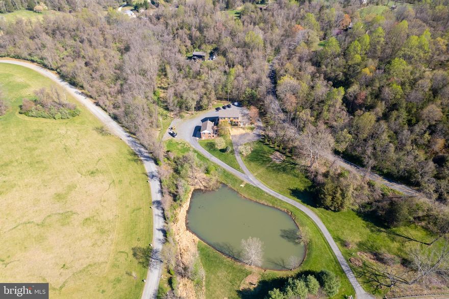 Endless Potential Between Middleburg & Aldie

This rare gem, nestled on 3.7 scenic acres of open and wooded landscape, offers the perfect blend of privacy, flexibility, and opportunity. Just minutes from the historic villages of Aldie and Middleburg—and only one hour from Washington, DC—this property is ideal for anyone seeking a peaceful retreat, home-based business setting, or multi-generational living.

The mostly brick 5-bedroom, 3.5-bath home was previously used as a home business but can easily be reimagined as a spacious private residence. It’s a blank canvas, ready for your personal vision.

The main kitchen space is fully built out and waiting for your finishing touches—just add your preferred appliances, finishes, and fixtures to bring your dream kitchen to life.

The fully finished lower level features its own entrance, full kitchen, and full bath, offering tremendous flexibility. Use it as an in-law suite, guest quarters, kids’ hangout, home gym, or yoga studio.

Bonus Structure with Unlimited Potential:
The detached two-bay brick garage includes 750 square feet of unfinished space—perfect for a guest house, rental apartment, artist studio, or private home office. Utilities and EV charging are already in place.

Existing kitchen appliances convey, "as-is."
Seller to offer $50,000 credit/seller subsidy/closing cost assistance at closing.

Features Include:

* Gorgeous mountain views overlooking a private pond

* Paved driveway

* Second dwelling on the property—ready for you to make it your own

* Multiple indoor and outdoor living areas

* Accessibility features, including main-level ramp access

* FIOS internet—ideal for remote work

*  Wood floors, built-ins, and charming architectural details throughout

* Brand new septic tank and distribution box

Whether you're looking to create your dream home, launch a home-based business, or build a multi-use compound, this property offers unmatched value, space, and setting.

Just bring your creativity—this is more than a home, it’s an opportunity. Come imagine the possibilities.