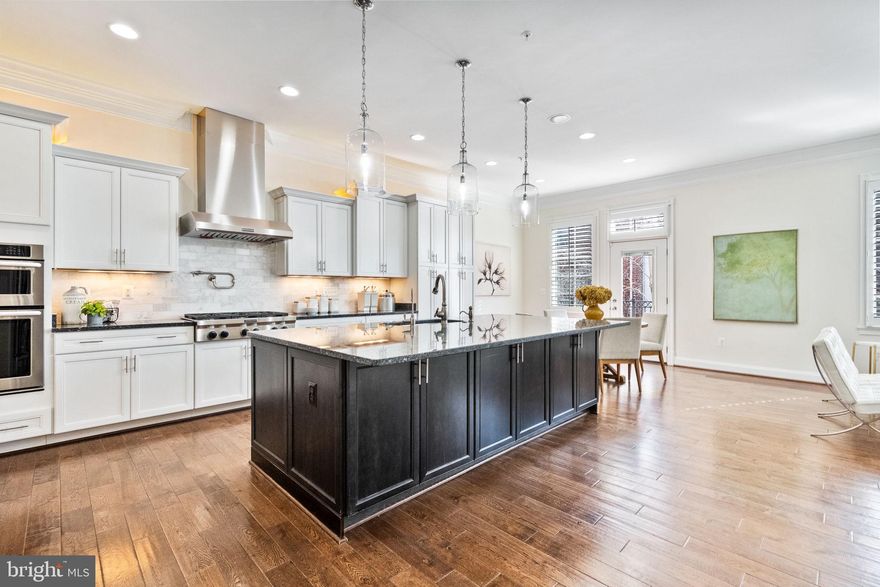 Are you looking for perfection in your Washington, DC home?  Here it is!
<br><br>
This elegant, executive-level residence is created for entertaining and easy living.  Forget that this is built as a townhome – it’s designed like a single-family home with spacious rooms and such a comfortable flow. Here you have a layout for comfortable hanging-out, cocktail receptions, large dinners along with guests and office privacy. The pinnacle of DC living is the gorgeous views of the Washington Monument and Capitol Building from your private roof deck.  Hosting a July 4th fireworks viewing party is a must!
<br><br>
This absolutely sun-filled home with walls of windows brings in the southern exposures all day!  
The 2-car expanded garage enters the house on the lower-level—with direct access to the elevator that serves all 4 floors.  
<br><br>
The main level features a cabinet-filled open kitchen with a perfect center island for entertaining and quick dining.  Over-cabinet, under-cabinet and accent lighting enhance the elegance. There’s an area for a kitchen table too. The kitchen is part of a casual sitting area with built-in bookcases – perfect for a relaxation.
<br><br>
The main floor showcases a perfect dining room and living room. With a wall of full-size windows, high ceilings and crown moldings you are surrounded by glamour.
<br><br>
On the 3rd floor the owner’s bedroom suite is expansive and features an amazing walk-in closet with a custom shelving system.  The bathroom – renovated in 2023  is a perfect spa oasis. There’s a second bedroom, bathroom and laundry room on this level too.
<br><br>
The 4th level highlights an office / den space with built-in bookshelves. There’s another bedroom and full bathroom too.  This level also walks-out to a level deck with the most Washington DC views!  A double-sided gas fireplace adds to the ambience for evenings star-watching and monument viewing!