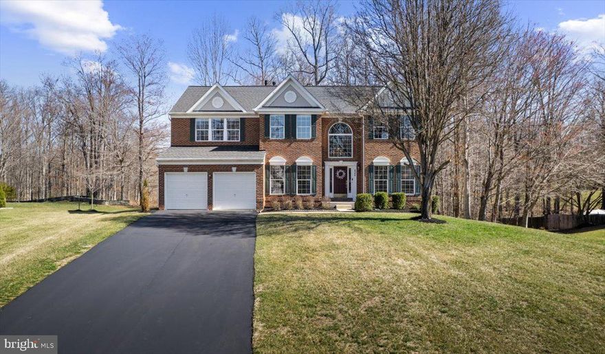 Welcome to 9306 Eagle Ct,  in sought-after Blooms Crossing, nestled between Manassas and Clifton.  Scenic Walking Trails back to this private Retreat!   Tucked away on a quiet .46-acre lot, this stunning home offers privacy, space, and upgrades galore! Backing to the former General Ridge Golf Course, now transformed into beautiful walking trails, this property delivers serenity and nature in your backyard.
Step inside a cathedral foyer and be welcomed by gleaming hardwood floors throughout the main level. The spacious family room features built-in shelves, a cozy gas fireplace, and picturesque views of the woods, creating the perfect relaxing space. A main-level office offers a quiet retreat for work or study, while the huge kitchen—complete with a center island, 42-inch cabinets, stainless steel appliances, gas oven, and deck access—is perfect for entertaining.  Upstairs, you’ll find four spacious bedrooms, including a primary suite with its gas fireplace, a cozy sitting area equipped with a wet bar & mini fridge, a walk-in closet, and an updated en-suite bath with a jacuzzi tub. The lower-level walk-out is flooded with natural light and opens to a patio and level backyard, offering even more space to enjoy—a huge additional bedroom, full bath, and ample storage complete this impressive home.  Meticulously maintained by its original owners, this home is truly move-in ready! Don't miss your chance to own this private retreat with unbeatable views and modern upgrades—schedule your showing today!