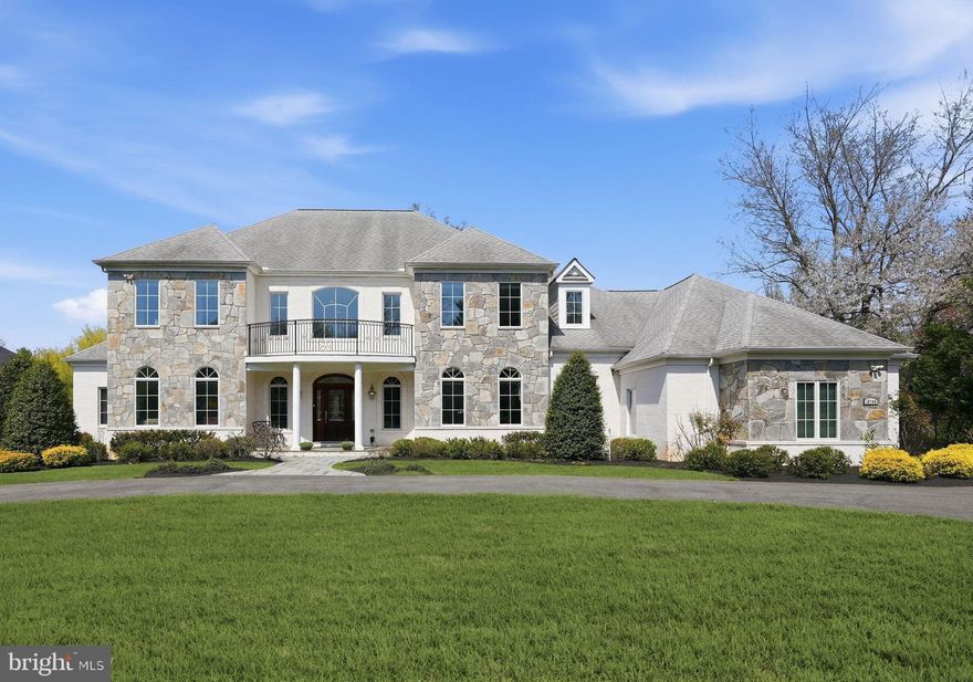Welcome to this custom-built 2012 residence in the heart of Potomac, offering 11,039 square feet of refined living space on 1.57 acres. A sweeping horseshoe driveway sets the stage for a grand arrival, leading to a custom front door and a stunning two-story marble foyer. From there, the home opens to an elegant living room with a gas fireplace and a double-story coffered ceiling with nine-panel detailing. Palladian windows and glass doors line the rear of the home, flooding all three levels with natural light. Entertain with ease in the formal dining room. The gourmet kitchen is thoughtfully appointed with a large island, breakfast room, and walk-in pantry. The great room features 12-foot ceilings, a dramatic two-tier tray ceiling, and a striking stone fireplace. The inviting sunroom offers year-round enjoyment. The main-level owner’s suite is a private retreat, complete with his-and-hers bathrooms and oversized custom walk-in closets and private terrace. The upper level features four generously sized en suite bedrooms, along with a spacious sitting area on the landing. Designed for convenience, it also offers an additional upper-level laundry with a pre-installed hook-up. An expansive walk-out lower level designed for entertaining, complete with a full bar and home theater, plus a private en suite bedroom and a versatile gym or craft room.  An added bonus—additional unfinished spaces offer endless potential for customization. Outdoor living spaces can be enjoyed from every level of the home, featuring a serene Zen-inspired backyard with a lilly pond, waterfall, walking bridge, and a brick patio for al fresco dining. Ideally located within walking distance to the C&O Canal and a short drive to the nation’s capital!