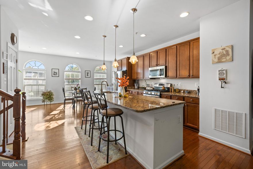 Experience the perfect blend of comfort and elegance in this remarkable 3-bedroom, 3.5-bath home that is bathed in natural light. From the moment you step inside, you'll be captivated by the spacious and bright environment that this home offers.
Tall ceilings throughout the home create an inviting ambiance. Expansive windows flood the living spaces with natural light. The open floor plan ensures seamless flow from room to room, making it a delightful space for both relaxation and entertaining.
The gourmet kitchen features a large island that doubles as a breakfast bar and is equipped with stainless steel appliances. Whether you're a culinary enthusiast or simply love to gather with family and friends, this kitchen is a true delight. 
This home has a bump-out that increases the square footage on all three levels. The extra space on the main floor features sliders that open to your private patio overlooking the lush backyard that backs to trees, providing a serene retreat and a perfect place for outdoor dining and relaxation.
The finished basement offers a large living space, complete with a full bathroom, making it an ideal area for game nights, home theater, or additional guest accommodations.
The primary bedroom is a haven of luxury, featuring a spacious layout, a large soaking tub in the en-suite bathroom, and an attached office space that provides convenience for those who work from home or need a quiet retreat. The second floor is completed by two additional bedrooms, a full bathroom, and upstairs laundry. 
This home also features an attached 2-car garage, recessed lights, and elegant hardwood floors. The HOA takes care of snow removal and lawn maintenance. Discover the ideal combination of spacious living, natural beauty, and modern design in this gem - don't miss the opportunity to make this exceptional property your home!