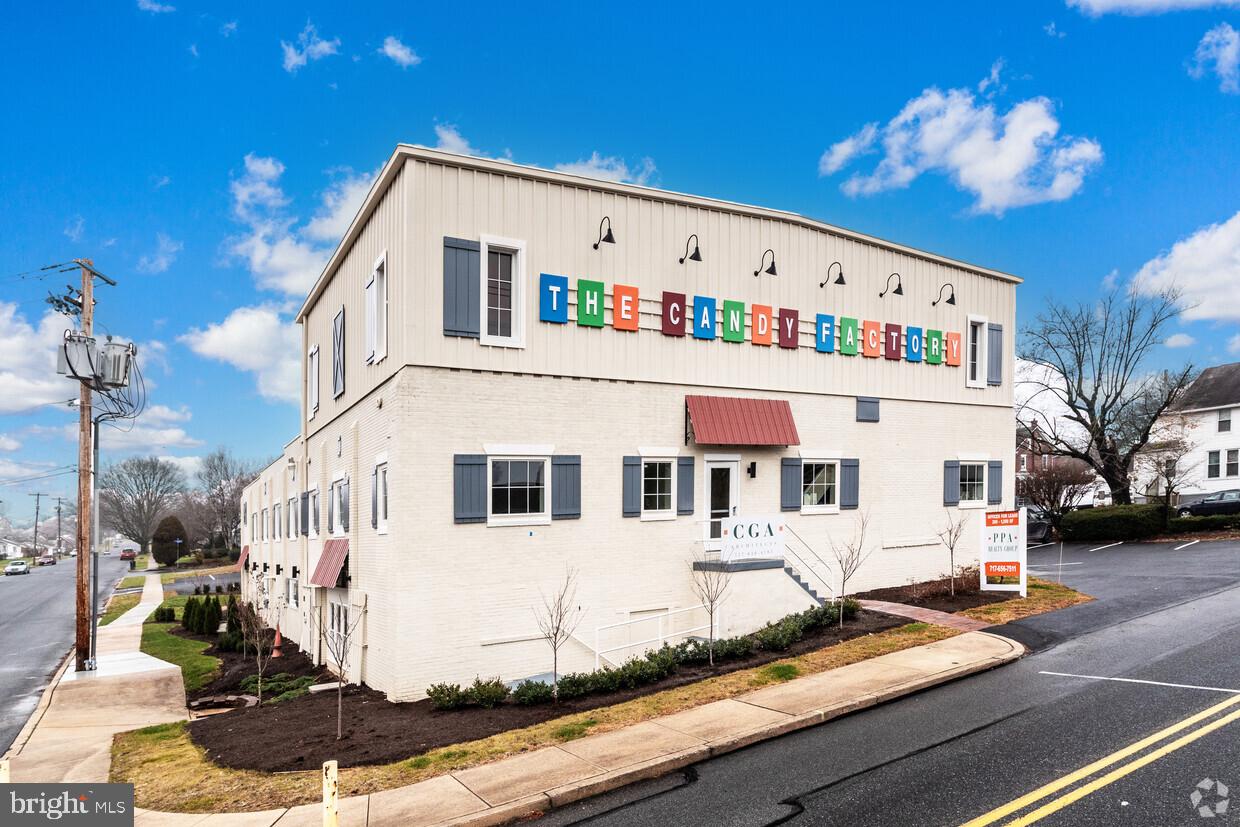 Discover a unique office opportunity at the Elizabethtown Business Center at The Candy Factory! Once home to Simon's Candy Factory, this beautifully restored professional building blends historic charm with modern convenience. Offering 21 turnkey suites for lease, this property features an all-inclusive lease structure—covering all utilities, WiFi, trash service, and common area maintenance—ensuring a hassle-free experience with no hidden costs.
Suite 201 offers 480 SF of versatile office space, perfect for professional or medical use. Conveniently located near the entrance and lobby, this suite offers easy access to ample on-site parking, making it an excellent choice for businesses prioritizing convenience and accessibility. Tenants also enjoy access to shared amenities, including a conference room, kitchenette, and an on-site fitness center.
Nestled in a residential area near Elizabethtown’s business district, this office provides a prime location for professionals seeking both convenience and character. Don’t miss this chance to lease space in one of Elizabethtown’s most cherished landmarks!