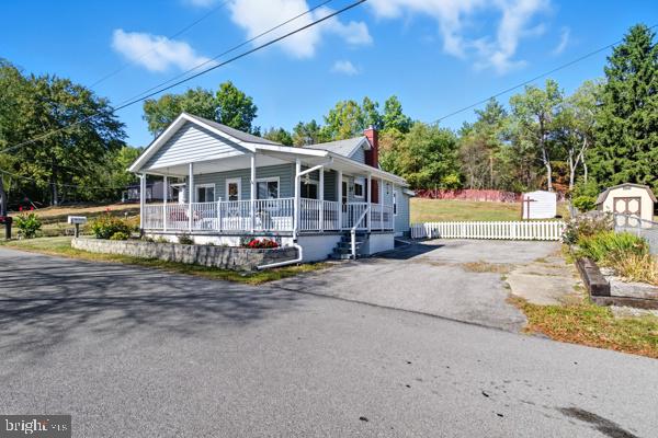 This delightful 2- bedroom, 1 bath home offers comfort, character and convenience. A beautiful front porch with a cozy swing welcomes you to sit back and relax, while the large back yard provides plenty of space for outdoor activities, gardening, or entertaining. Head inside where you will find updated flooring, new countertops and new stainless-steel appliances, making it truly move in ready. With a paved parking area and a layout that's cozy yet functional, this home is both inviting and easy to maintain. All this plus it's just minutes from town- giving easy access to shopping, dining and everyday conveniences while enjoying the comfort of home. Don't wait, this home won't last long! Schedule your showing today and make it yours before its gone.