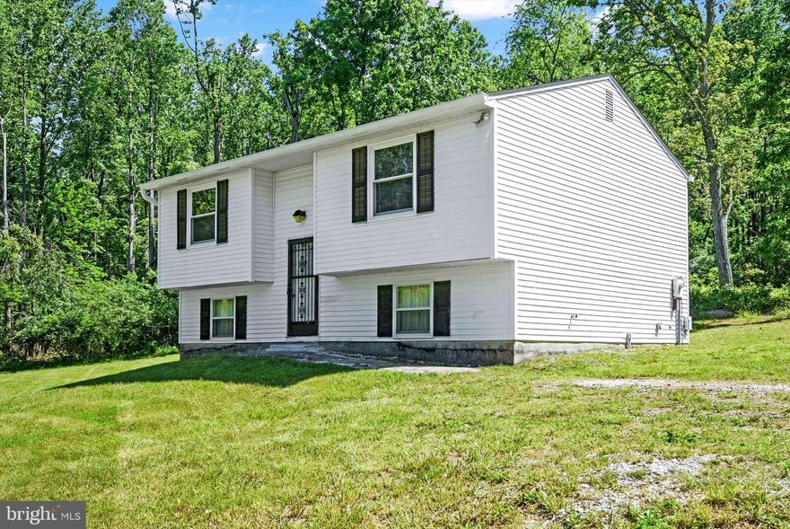 Discover this almost 6 acre gem - a private, wooded getaway! (You'll forget you have neighbors.) Enjoy rolling hills, a stream, and mature trees, and wildlife at every corner. This property is perfect for homesteading, hunting, storing your business equipment or simply enjoying nature. You'll love the building with electric that features a one car parking space with concrete floor, a loft and two additional bays. This building can be used to store equipment, raise animals, as a workshop, or for additional storage.  The home itself is simple and cozy, featuring 2 bedrooms and 1 bathroom. Plus, there’s a super unfinished walk-out basement that’s ready for you to make it your own. Add that third bedroom, family room or whatever you need.