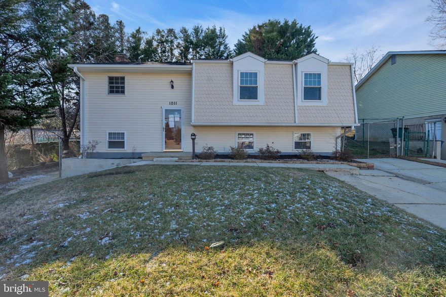 Freshly updated 4BR. 3BA home with a bright, open main level and great indoor/outdoor flow. New paint throughout, recessed lighting, and refinished hardwoods create a clean, move-in ready feel. The main level offers a spacious living room, dining area, and an updated kitchen with stainless appliances and generous cabinet space. Primary bedroom plus two additional bedrooms on the main level, supported by two full baths.
The finished lower level adds flexible living space with a large family room featuring a brick fireplace, an additional bedroom, a full bath, and a kitchenette. Perfect for guests, in-laws, or a rec room setup. Large deck with built-in bench seating overlooks the backyard and mature trees. Plenty of storage and utility space, plus a wide driveway for easy parking.