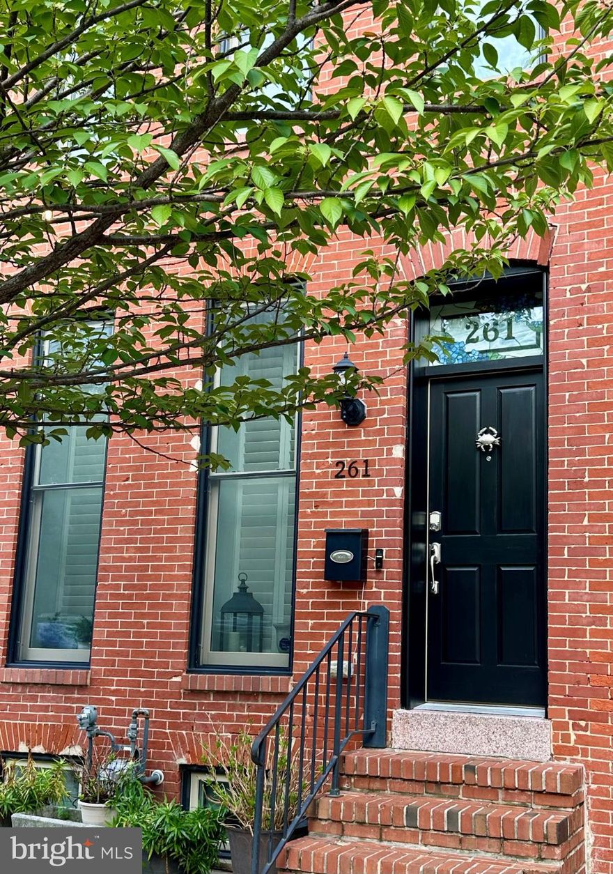 This charming and spacious EOG townhouse in the desirable Upper Fells Point neighborhood offers a perfect blend of historic elegance and modern convenience. Fully renovated in 2015, this home features 3 spacious bedrooms and 3 full bathrooms. Step inside to discover beautiful hardwood floors, a graceful curved staircase, exposed brick walls and a decorative mantle that adds character to the large living room. The heart of the home is the kitchen and dining area, showcasing white shaker cabinetry, upgraded countertops, stainless steel appliances and ample room for a large dining table. The 2nd floor includes the primary bedroom and private bath, large secondary bedroom, hall bath and access to the large roof deck with skyline views. The lower level includes the 3rd bedroom/office or family room with high ceilings, the 3rd full bath, laundry closet with stackable front-loading washer and dryer, large custom storage closets and 2 windows.  The home features recessed lighting, exposed brick, plantation shutters on some windows, neutral paint colors, side windows and a back patio.  Charming Upper Fells Point offers walkability to neighborhood restaurants and pubs, close proximately to John Hopkins Hospital, Downtown, Patterson Park and the Fells Point waterfront.  This home offers an excellent layout and timeless design finishes!