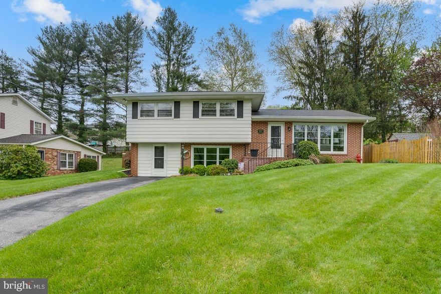 Beautifully landscaped 3BR/1.5BA split ranch located in the desirable neighborhood of Westminster.  Take the brick walkway to the front porch and open the door into your forever home.  Step into a bright and airy main floor with tons of natural light.  The spacious living room offers two large windows allowing for the bright interior.  Off the living room is a spacious dining room, beaming with sunlight, with a wide entry into the kitchen making for the ideal entertainment space.  The kitchen boasts wood cabinets, including a pantry, finished with crown moldings, and a double sink under a large window. Take a few steps up to the second floor and enter a spacious primary bedroom with access to the shared full bath, and two sizable secondary bedrooms.  The lower level offers additional living space with a half bath, laundry, storage, a playroom/office featuring a mini-split unit, a spacious family room with a large front window and doorway.  From the laundry room step out to the pristinely manicured fenced yard with a large paver stone patio that overlooks a yard filled with green space, and a storage shed.  This home is move-in ready and has so much to offer new homeowners including being within close proximity to shopping, restaurants, and commuter routes.