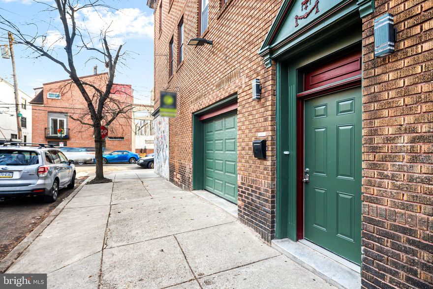Discover a rare versatile multi-family building in Philadelphia’s Bella Vista neighborhood bordering Washington Square West. This property easily offers the perfect blend of multi-generational living or rental income potential with modern city luxury! This adaptable property features two distinct living spaces plus an additional garage and lower-level den/entertainment space. It is an ideal opportunity for homeowners seeking flexibility, investors looking for an income-producing rental, or families wanting a separate private suite. Spanning multiple levels are 2 spaces that could be used as one home or individual units. The largest upper unit boasts 2 beds and 2 baths with a kitchen and dining areas! The spacious primary bedroom has an ensuite bathroom, skylight, and a seating area with dual closets with organization systems. The second bedroom has gorgeous floor-to-ceiling white built-ins, gets incredible light, and is directly across from a laundry closet equipped with a side-by-side new washer and dryer. The second full bathroom features a jacuzzi tub and shower, all fully updated. A cozy living room with a fireplace sets the perfect ambiance for relaxing nights. The fully updated kitchen has higher-end stainless steel appliances, white quartz countertops, and 2 tones maiden cabinetry. All spaces have access to a private deck that offers unobstructed, breathtaking city skyline views! The lower-level unit provides its own separate living space, complete with a Murphy bed, full bathroom, modern kitchen, and home office or flex space—ideal for extended family, long-term tenants, or Airbnb potential. Below the garage is a fully finished basement that adds even more possibilities, perfect for a home gym, movie theater, or den space, and has an additional full bathroom! Designed with style and functionality, this home has all-new interiors, so it's ready for move-in. Completing the home is a private garage with hand-painted floors, offering secure parking in the heart of the city.  A unique highlight of the property is its direct connection to Philadelphia’s famous Magic Gardens, with an original Isaiah Zagar mosaic art piece! With a Walk Score of 95, this location is a walker’s paradise, allowing daily errands to be accomplished on foot. Additionally, it boasts a perfect Transit Score of 100, indicating world-class public transportation options. With easy access to public transit, I-95, and major highways, this Bella Vista Beauty is a rare opportunity to own a versatile, property in one of Philly’s most sought-after neighborhoods.
