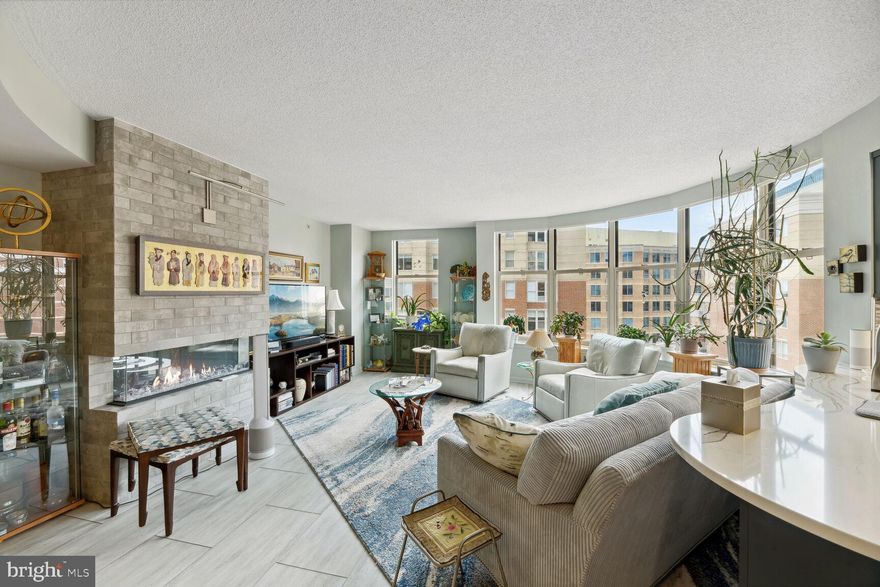 Completely renovated in 2021 down to the studs, this condo in Lexington Square is a stunner!   Luxury vinyl floors were installed throughout the entire living space.  The kitchen has brand new, blue cabinets with quartz counters  new GE Profile stainless steel appliances, new Asko washer and dryer.and a one of a kind curved breakfast bar that over looks the living/dining space.  The living area has a curved wall of windows accented by with a modern electric fireplace and stone heath and custom, remote controlled blinds. The open living space also includes a large dining space with a coffered ceiling.  3 Bedrooms with custom shelves and custom closets and an owners suite with pool views and a private bath with a new jetted tub and stand up shower with glass doors and marble tile.  The second bath has also been completely remodeled with a steam shower and led mirror lights as well as recessed lighting.  Honestly there is so much to say about this one, you just have to come see it for yourself.  The unit also comes with one convenient parking space.  

Lexington Square consists of 2 buildings with a pool, gym with an amazing location within blocks to both the Virginia Square and Ballston Metros, as well as the Ballston Quarter, Quincy park, a public library, shops, restaurants and so much more.