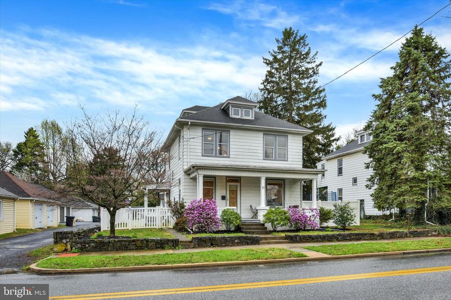 Welcome to this updated and well-maintained home in the heart of Mechanicsburg Borough. Step inside to a bright living space offering lots of natural light, new recess lighting and beautifully refinished hardwood flooring. Featuring new board and batten detailing, the dining room blends warmth and character with a beautiful pocket door and built-in cabinet creating an inviting space perfect for family meals and entertaining. The kitchen has been updated beautifully with new recess lighting, flooring, quartz countertops, stove, dishwasher, microwave, tile backsplash and sink. Upstairs are 3 bedrooms with beautifully refinished hardwood flooring and newer ceiling fans. A beautiful new bathroom was thoughtfully added to the primary suite, creating a private retreat you'll love - especially with the balcony overlooking the backyard, perfect for sipping your morning coffee. The hall bathroom has also been completely remodeled with all new finishes and flooring. This home boasts a spacious attic space that can be used for storage or finish it off for even more living space. The backyard is spacious and completely fenced, the perfect place for barbecues, parties or just relaxing with family. A one car garage is conveniently located behind the home. This home has been completely updated and ready for its new owners. It’s a joy to own!